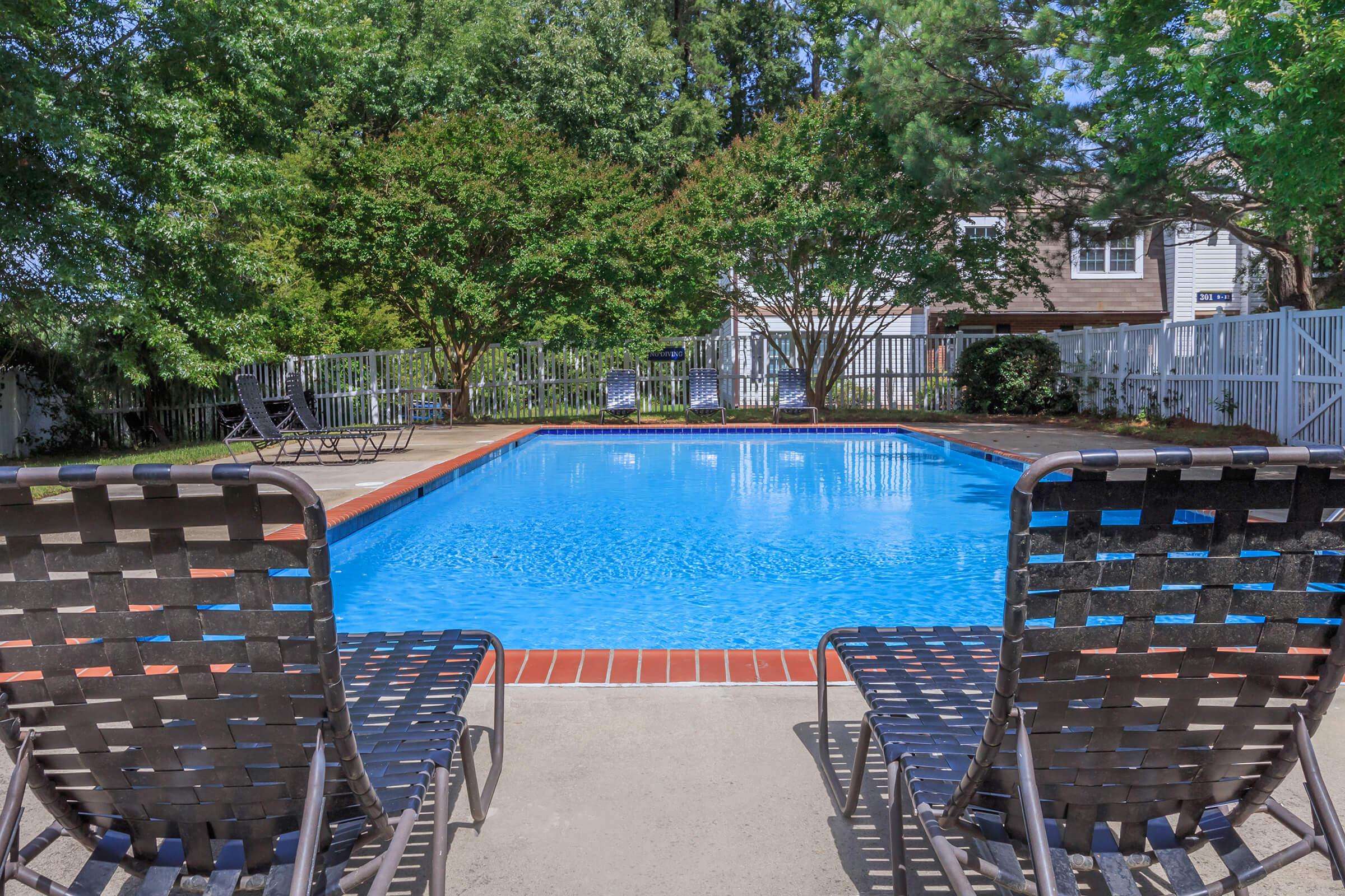 a chair sitting in front of a pool