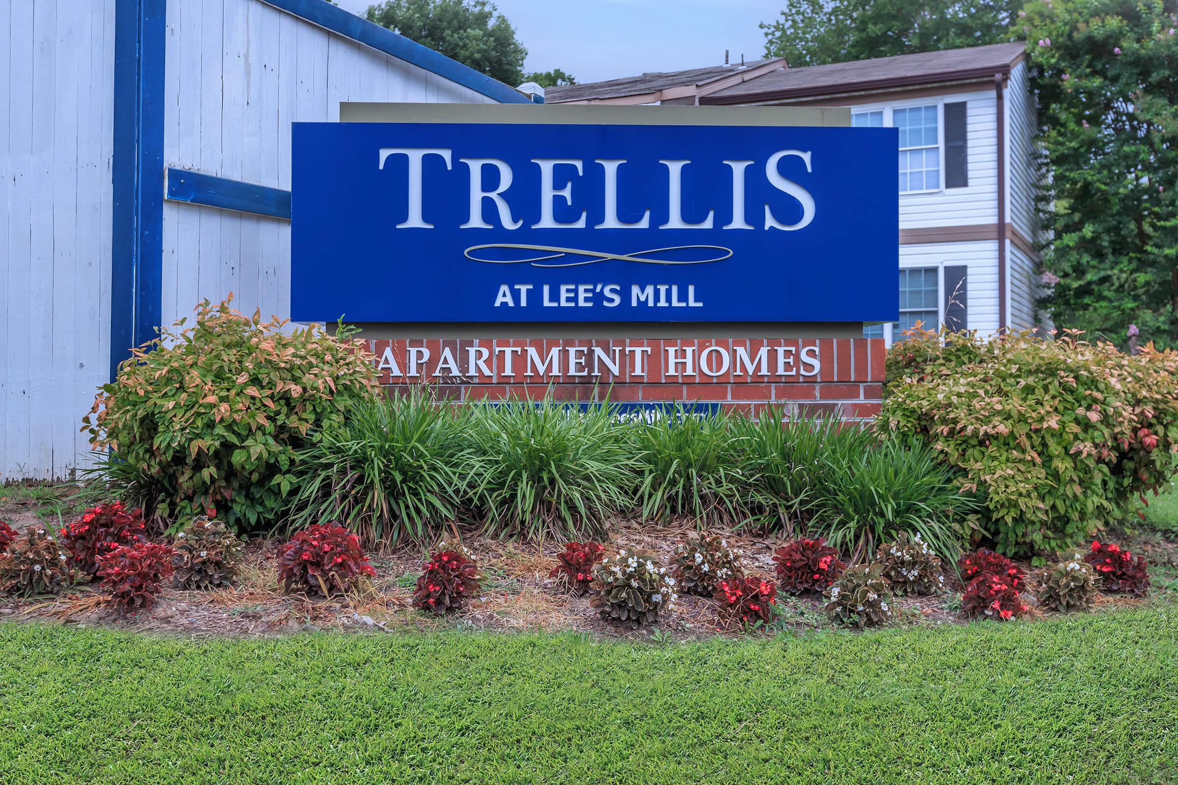 a blue sign in front of a house