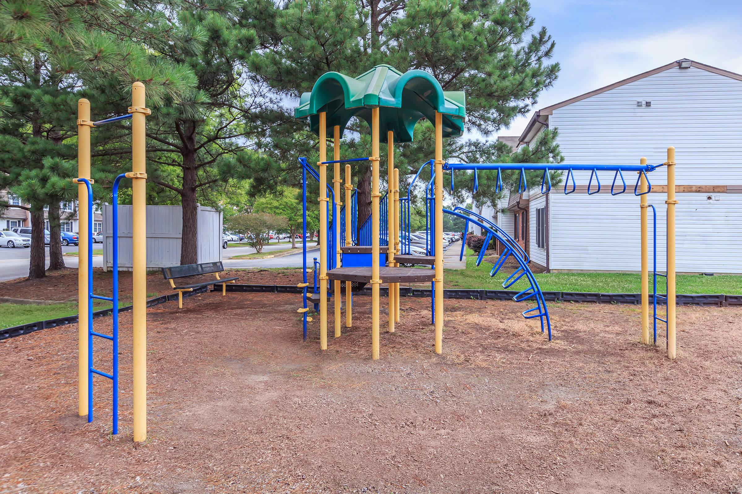 a playground in front of a fence