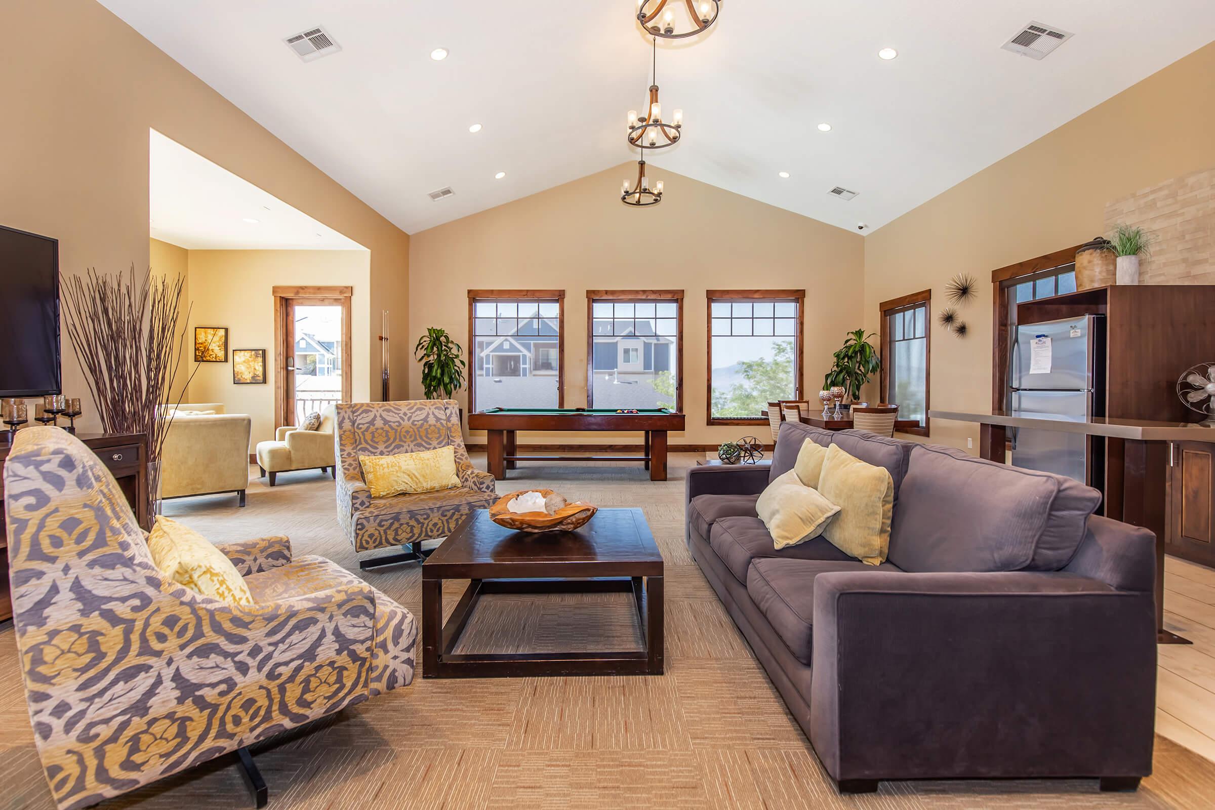 a living room filled with furniture and a fire place