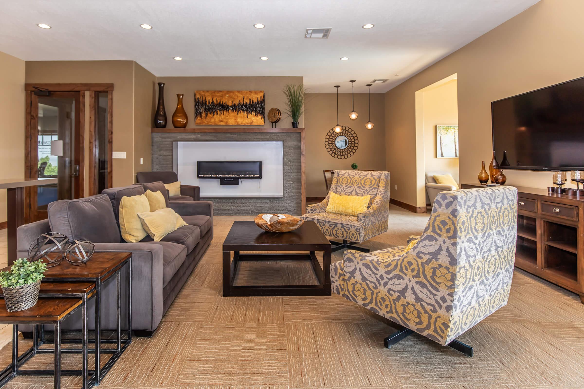 a living room filled with furniture and a fireplace