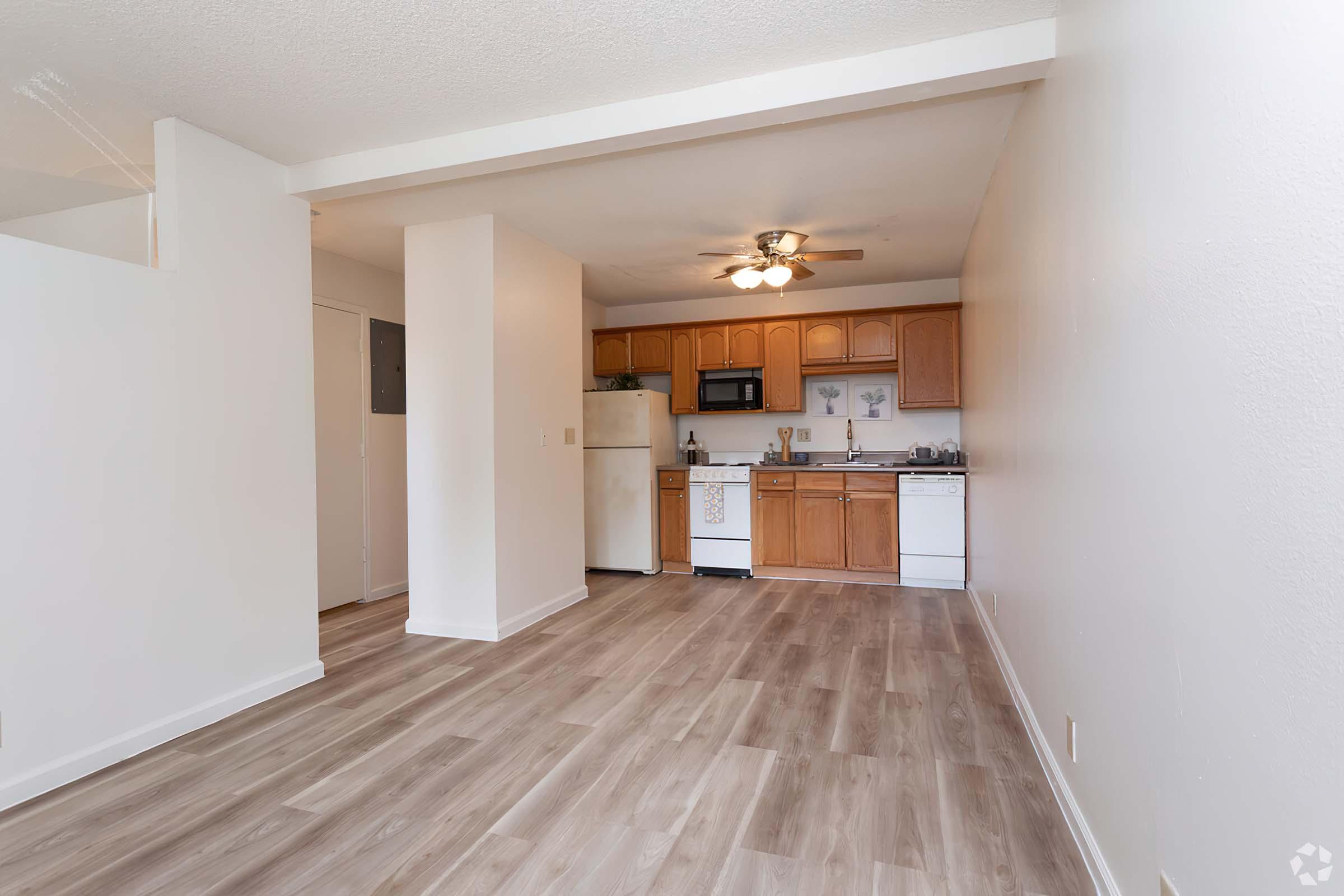 a large empty room with a wooden floor