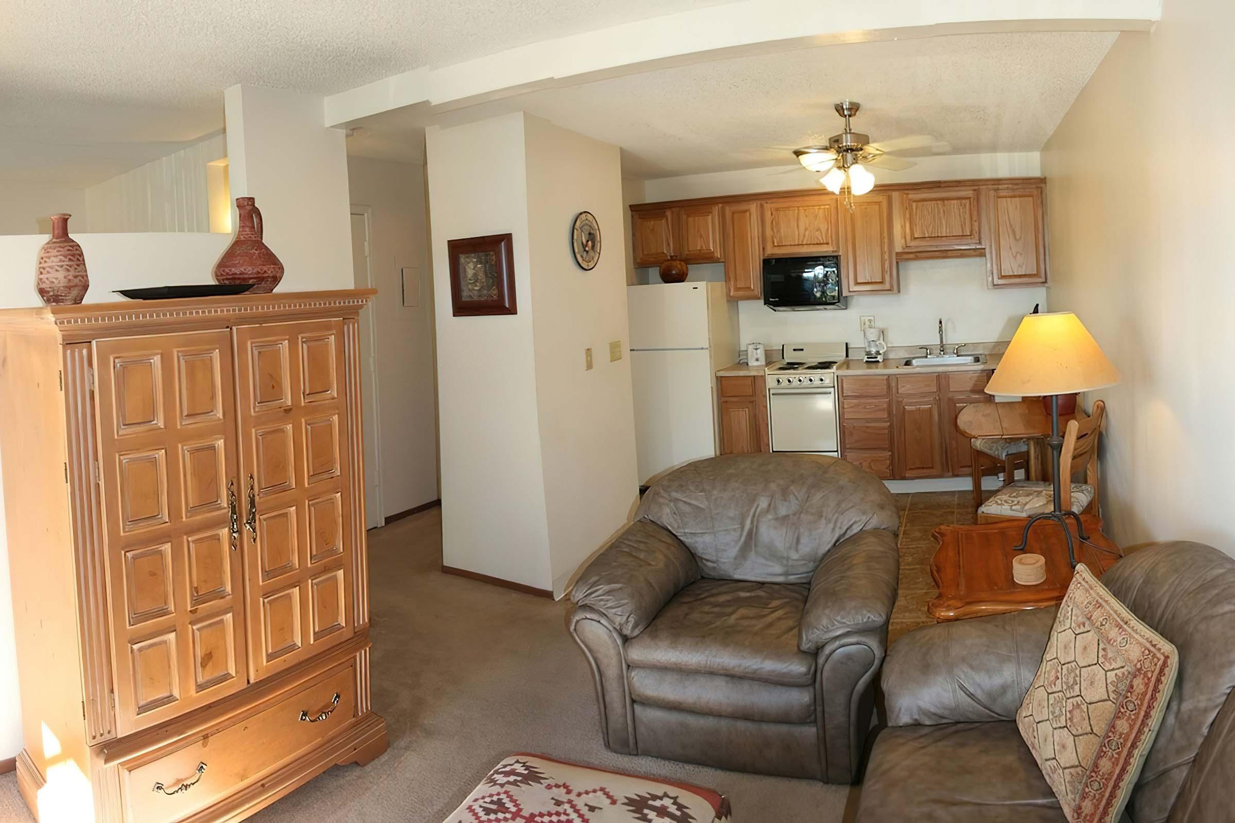 a living room filled with furniture and a fire place