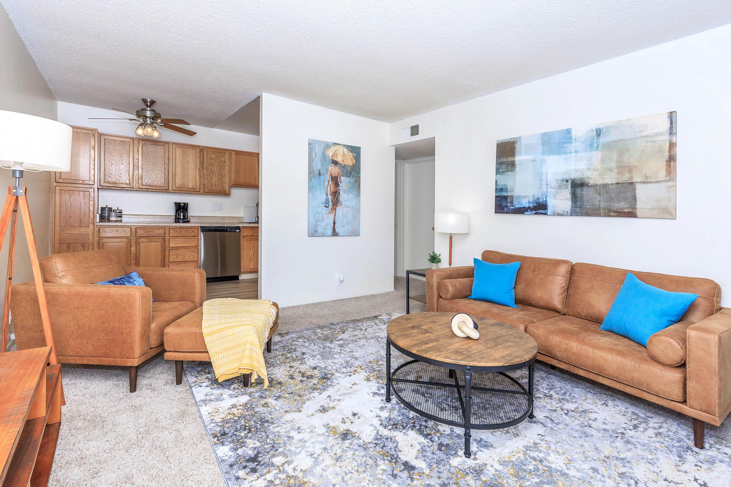 a living room filled with furniture and a fireplace