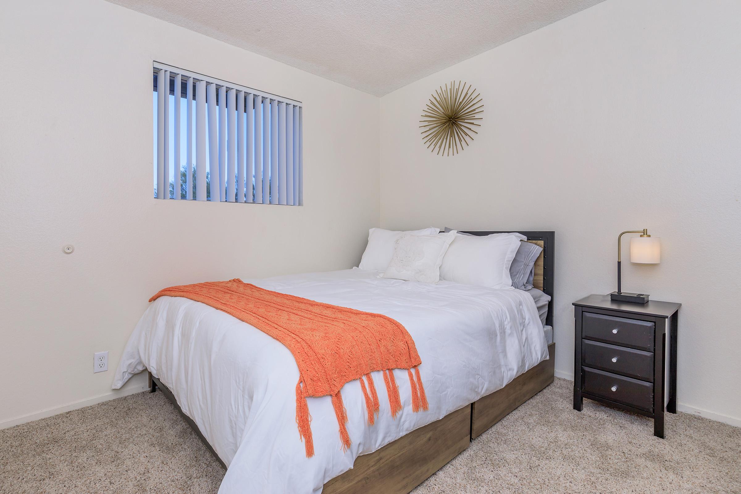 a bedroom with a bed in a hotel room