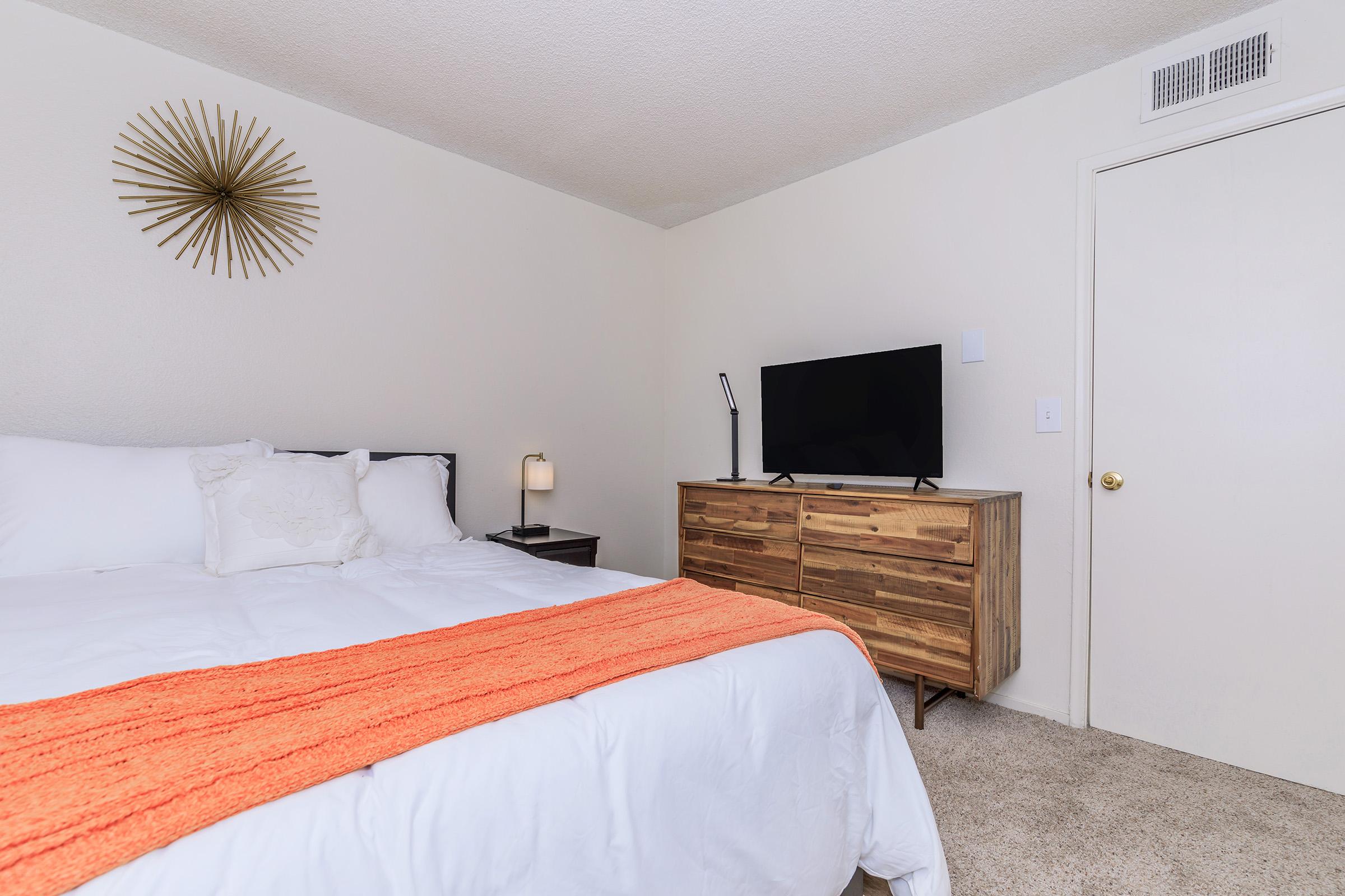 a bedroom with a bed in a hotel room