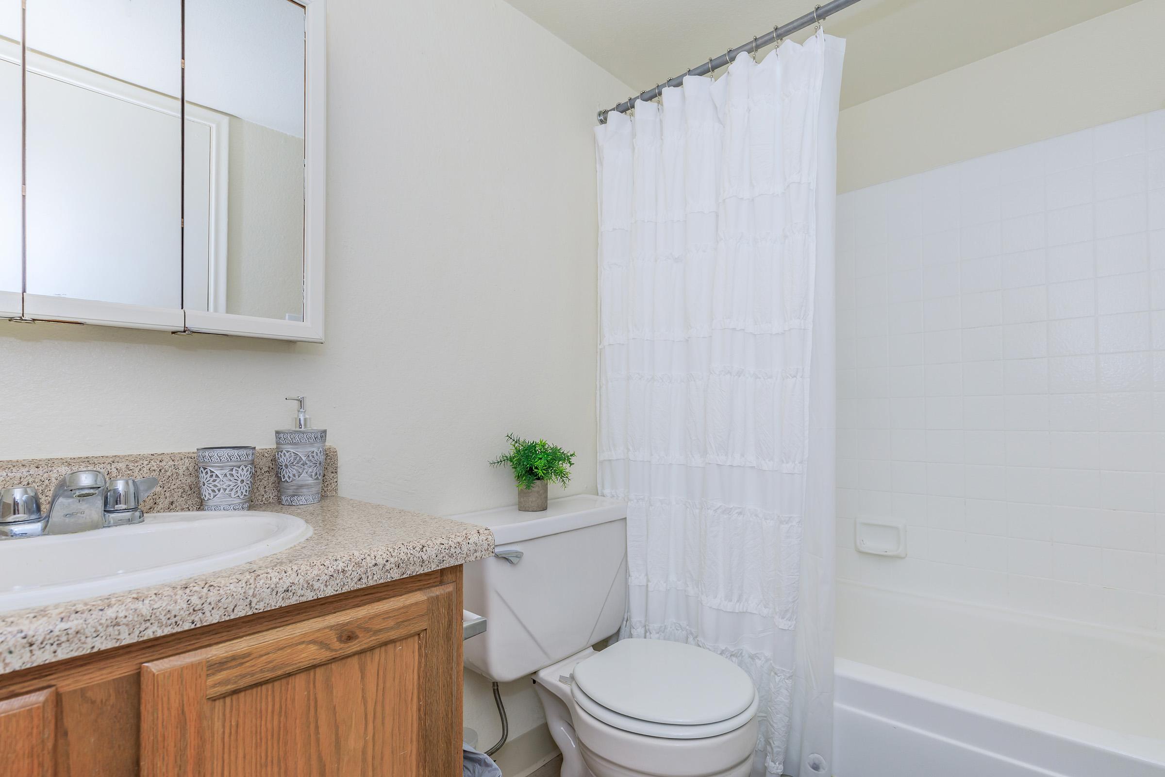 a kitchen with a sink and a mirror