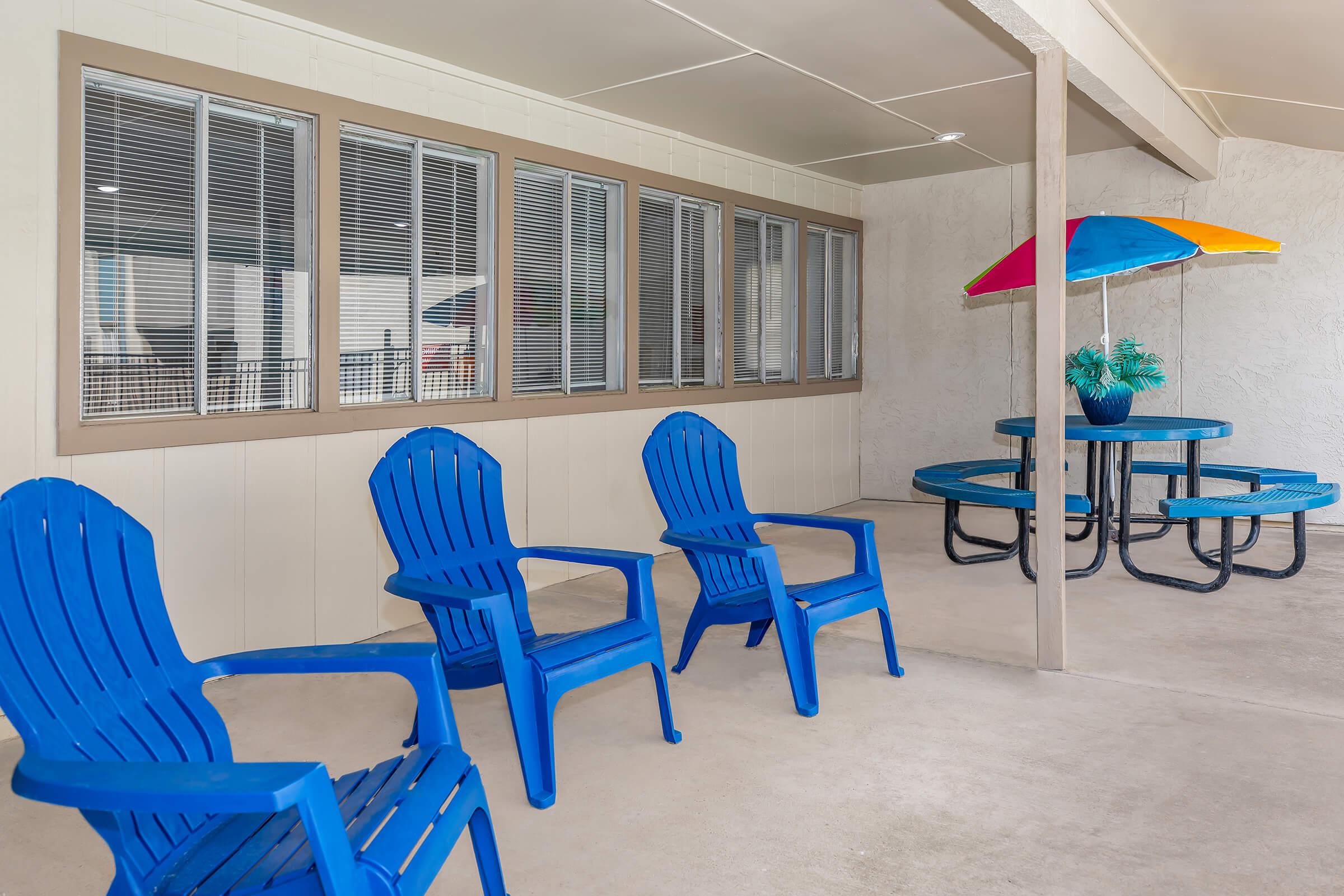 a couple of lawn chairs sitting on top of a chair