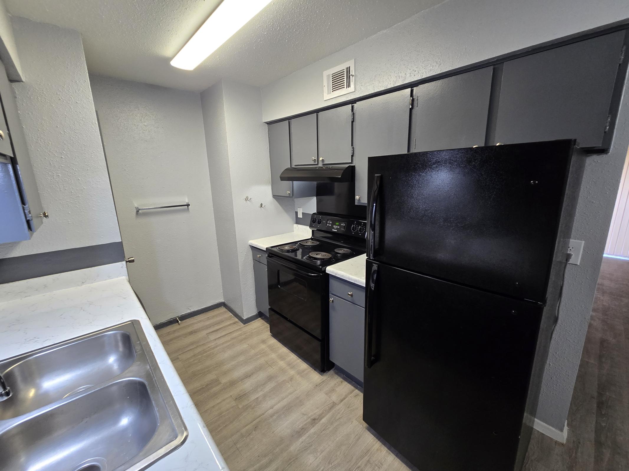 a modern kitchen with stainless steel appliances