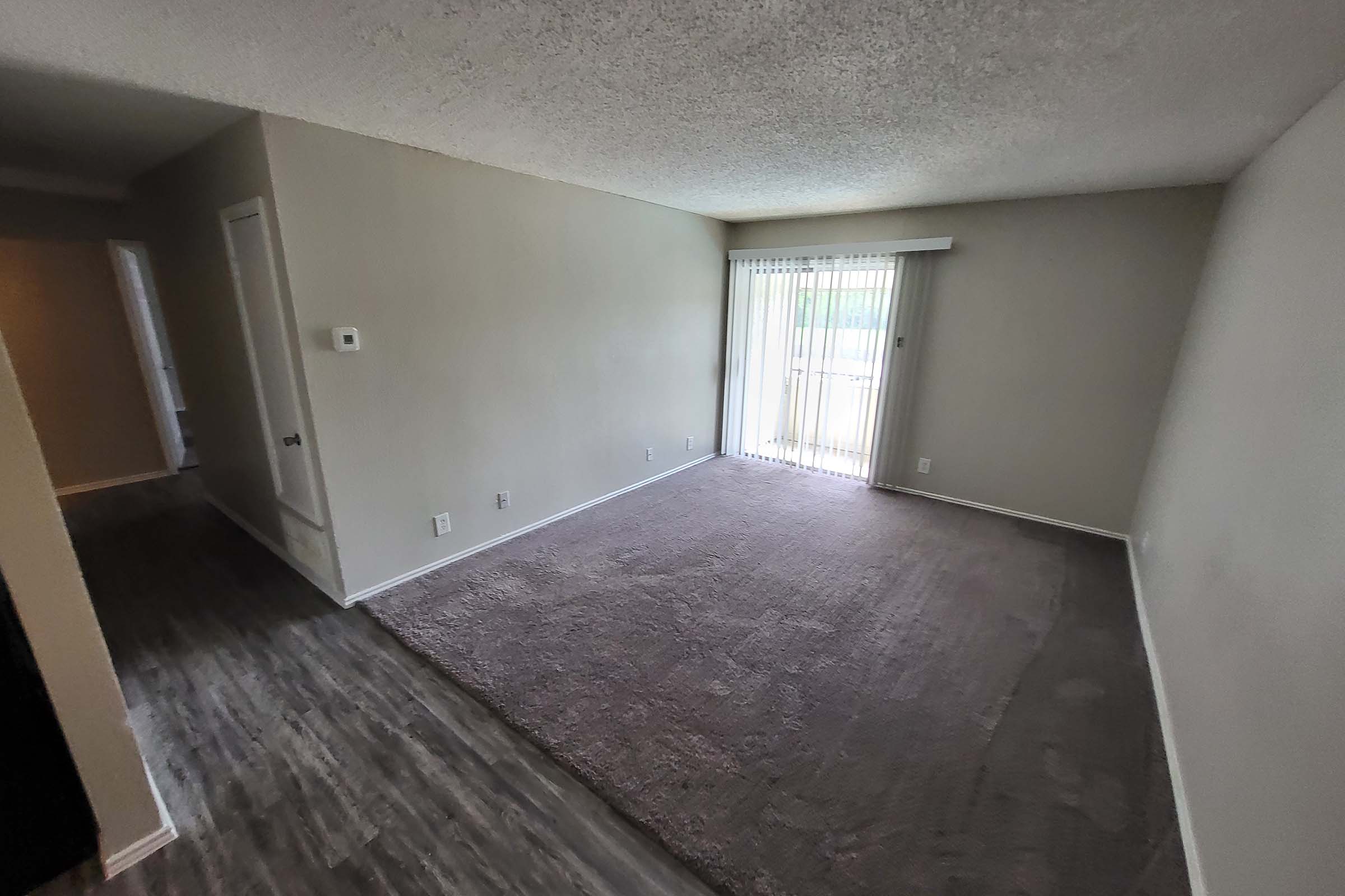 a bedroom with a wooden floor