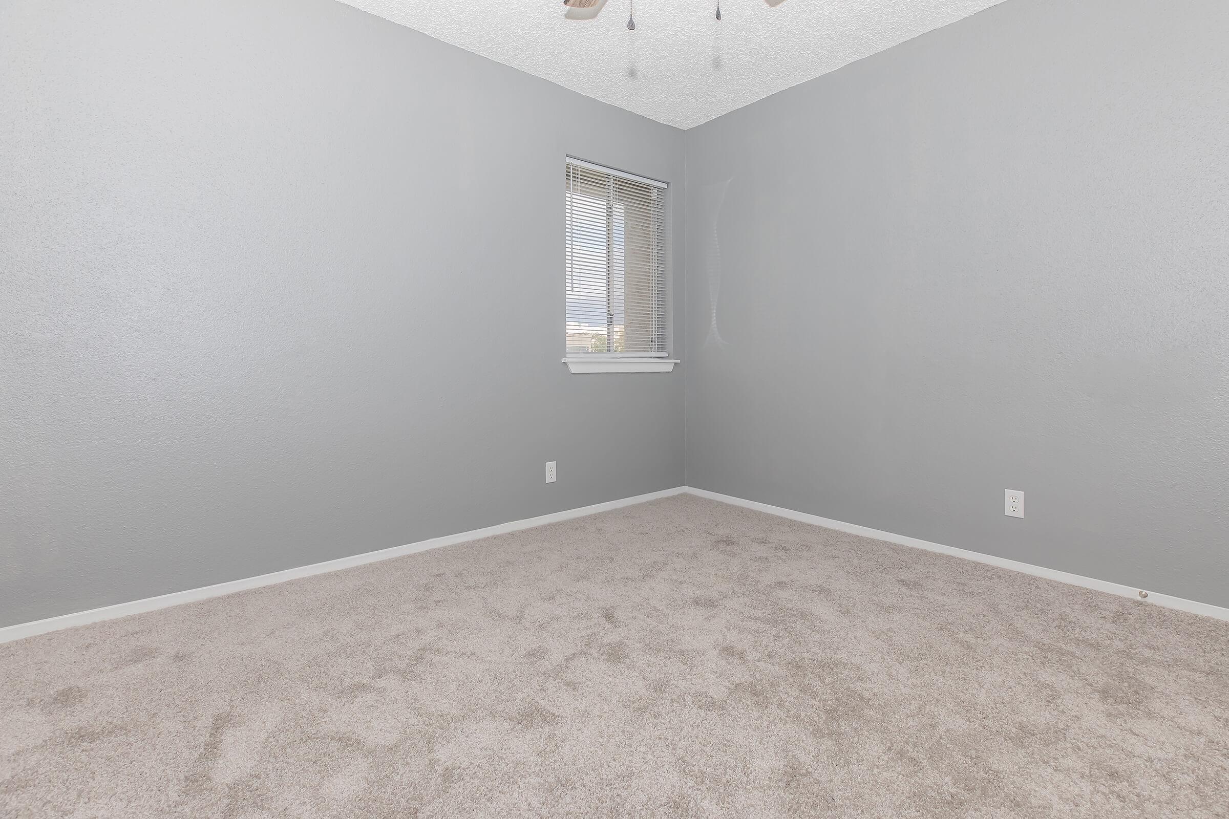 a view of a bedroom next to a window