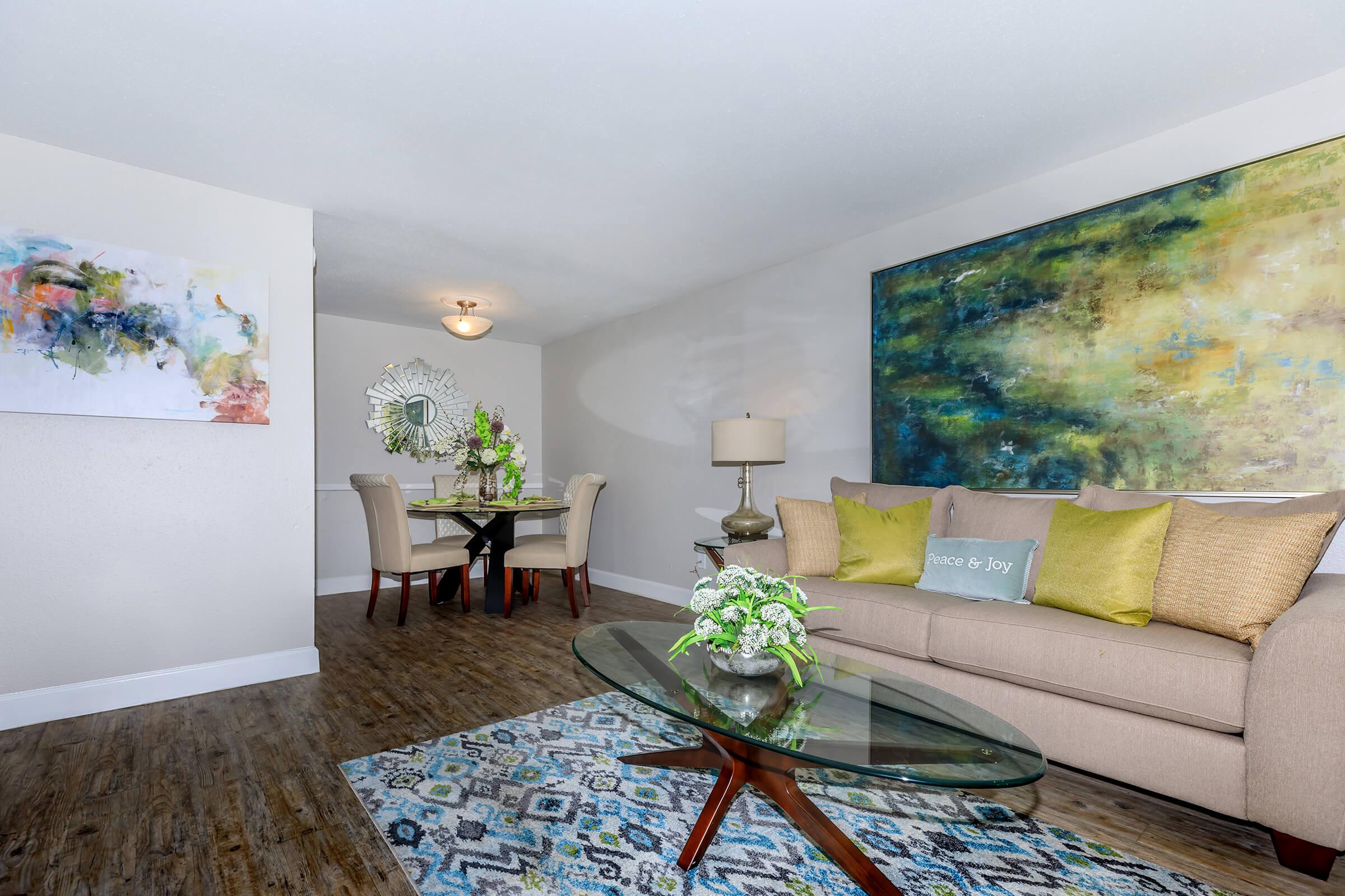 a living room filled with furniture and a rug