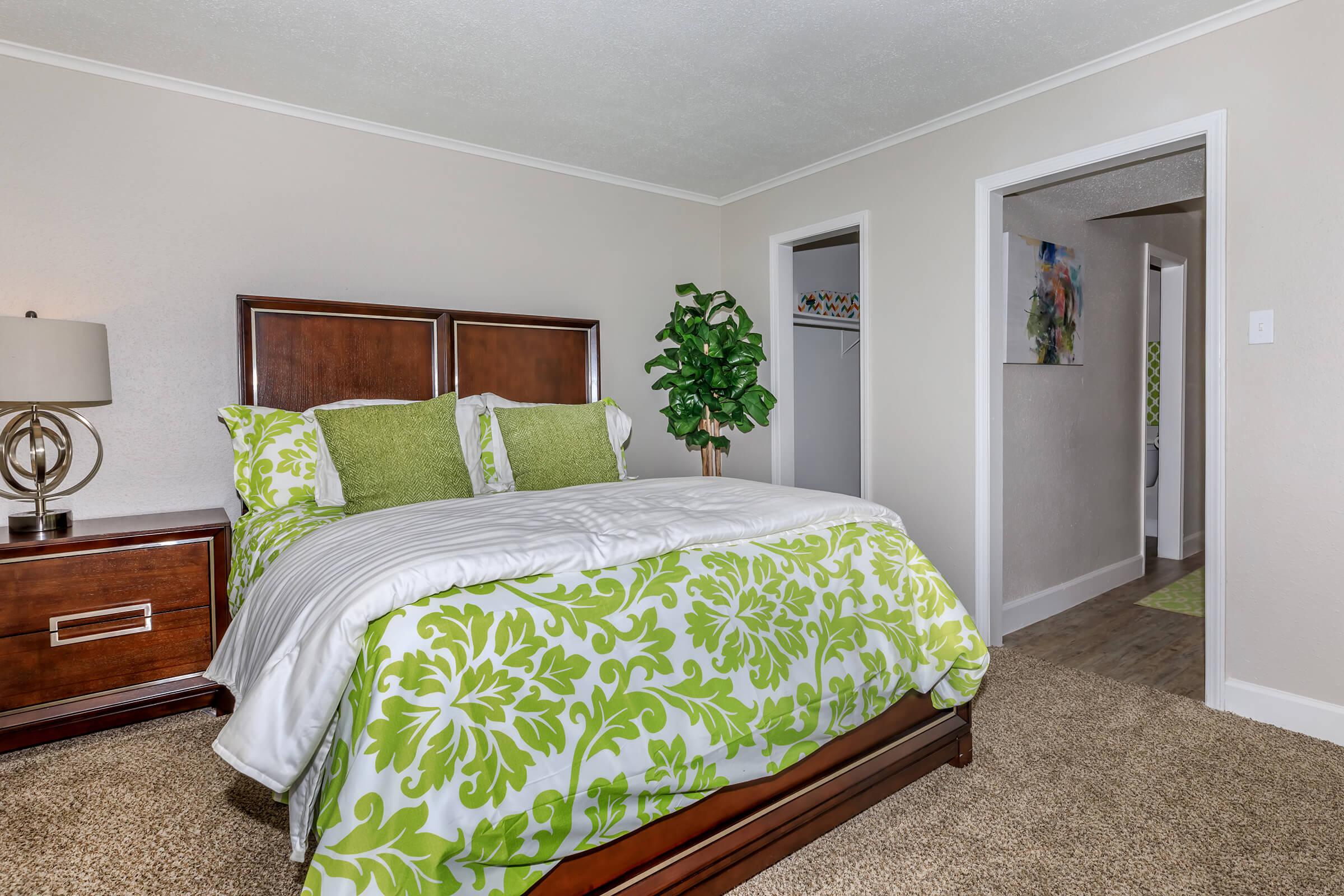 a bedroom with a bed in a room