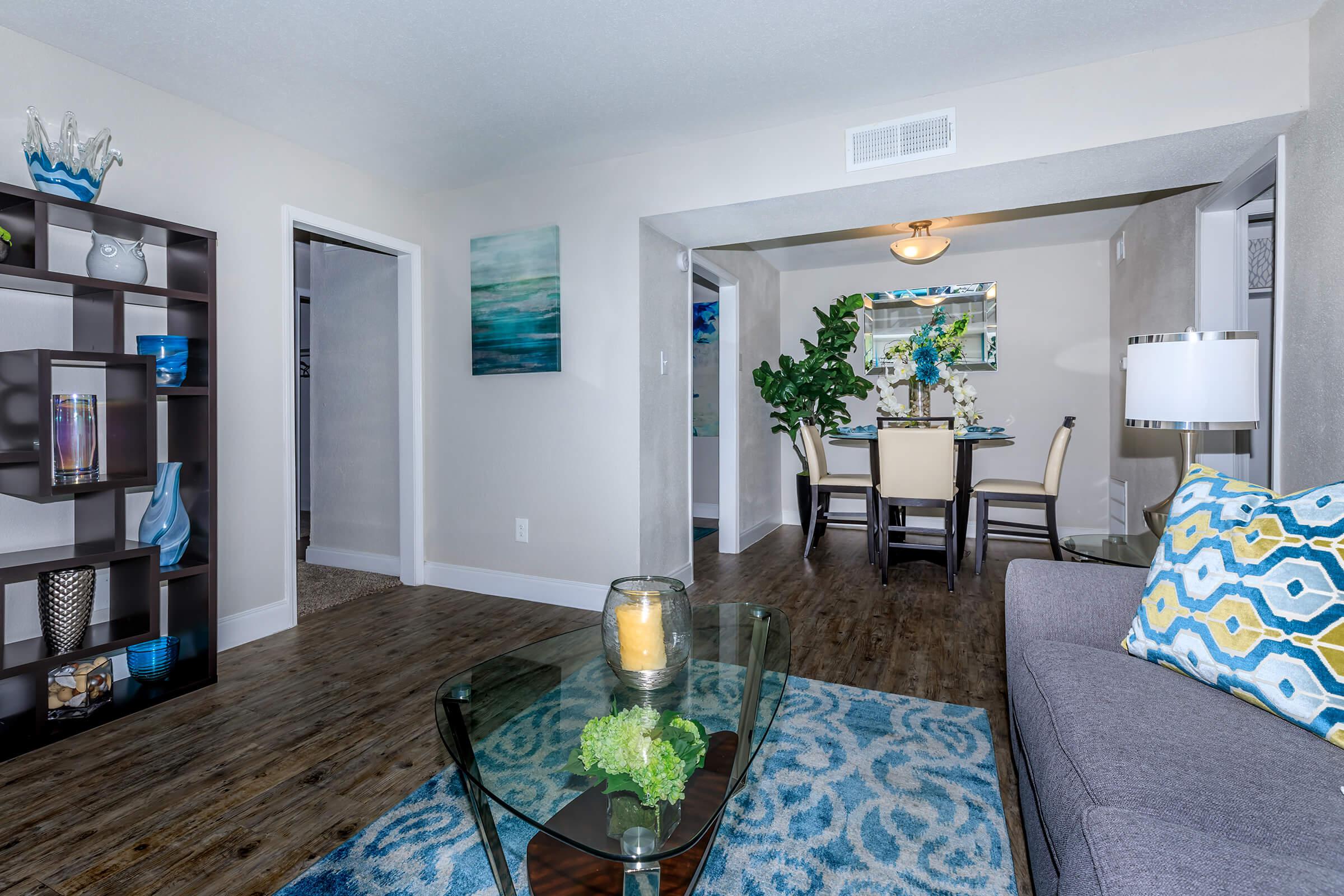 a living room filled with furniture and a flat screen tv