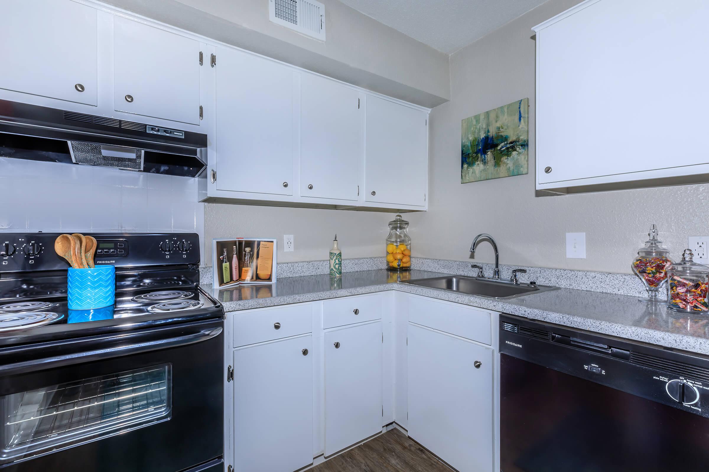 a kitchen with a sink and a microwave