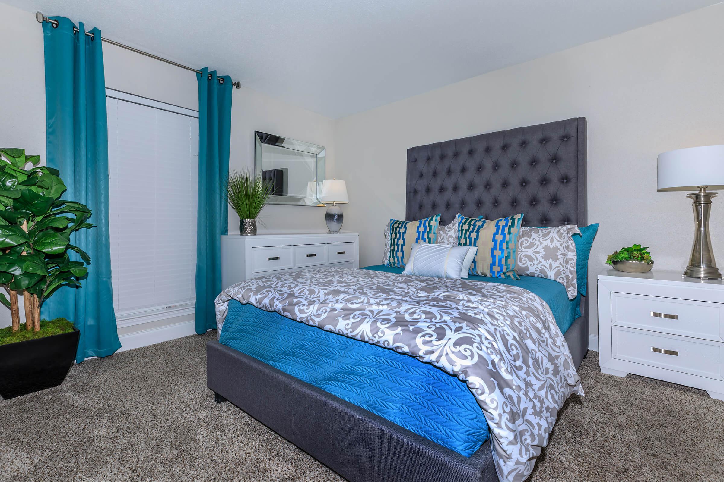 a bedroom with a bed in a room