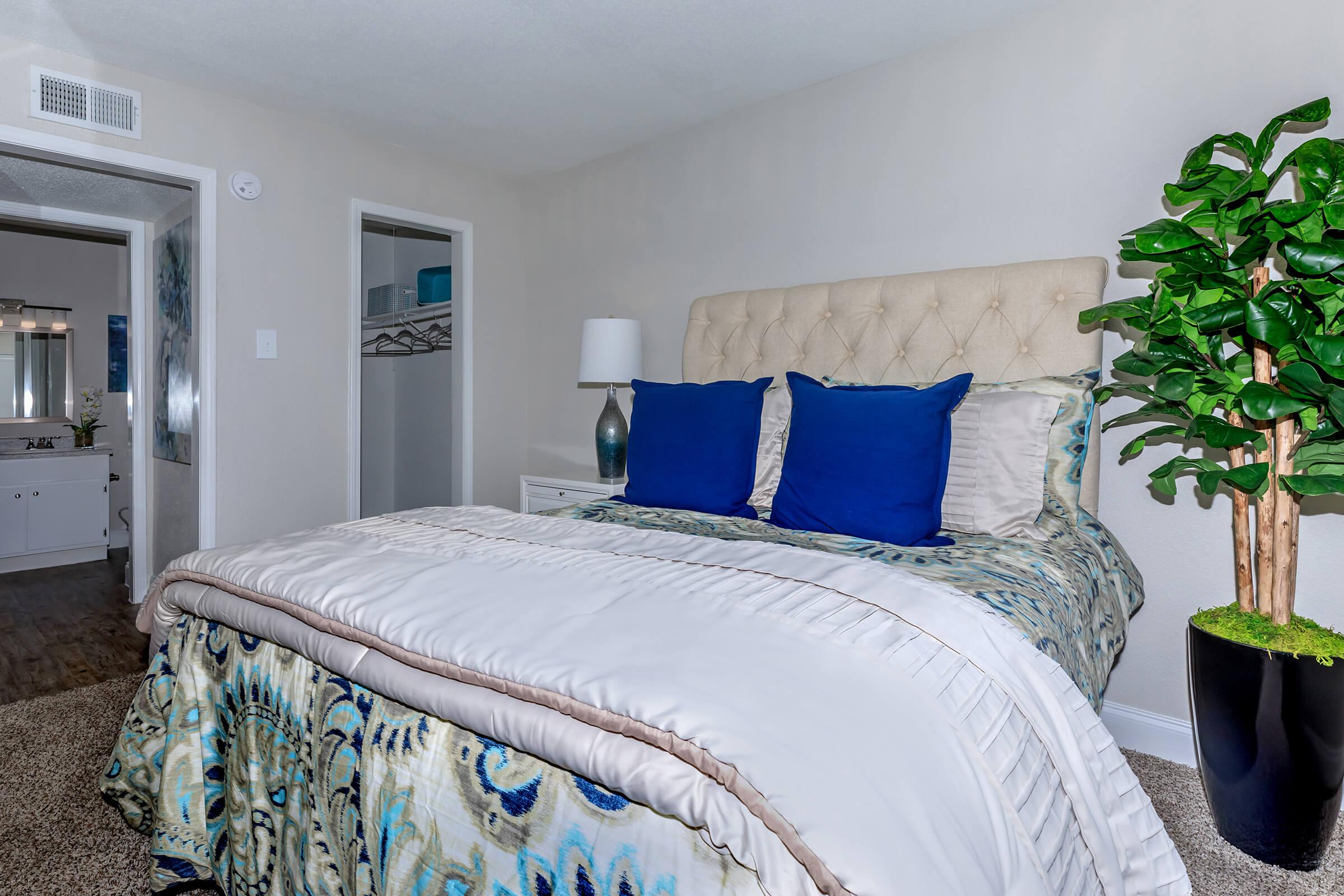 a bedroom with a large bed in a room