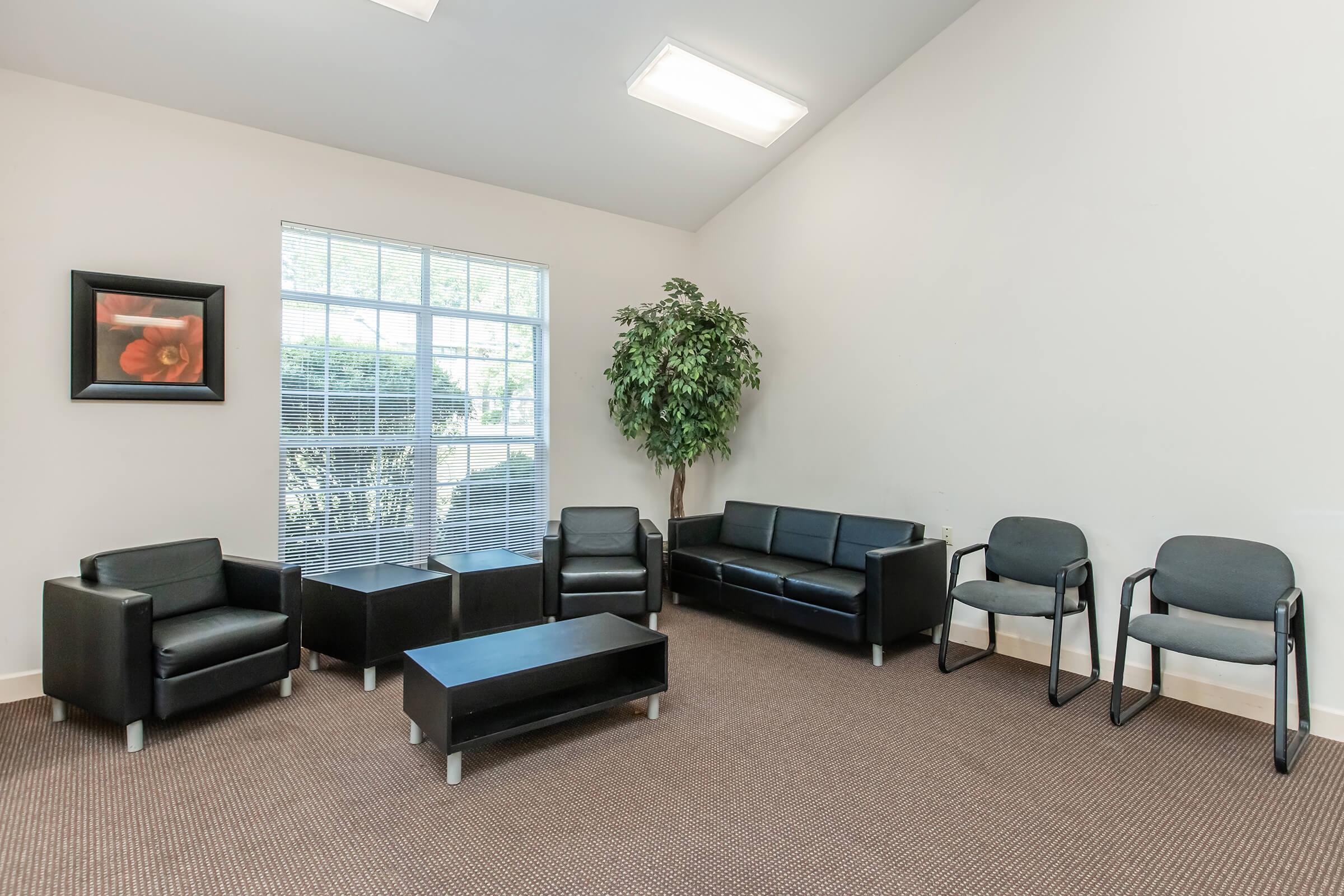 a living room filled with furniture and a tv