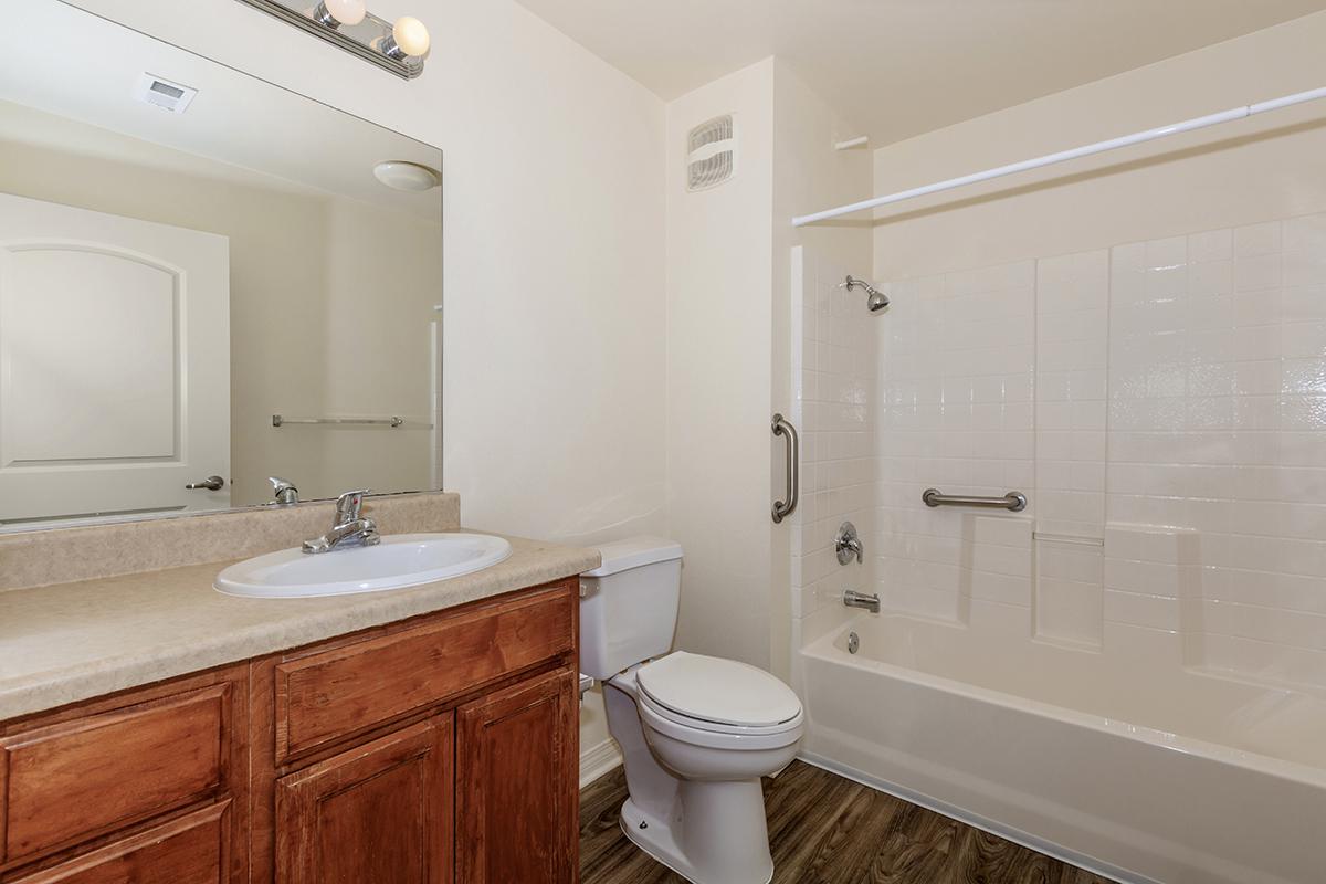 a large white tub sitting next to a sink