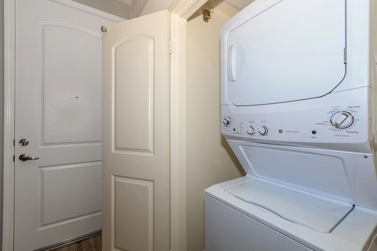 a white refrigerator freezer sitting next to a door