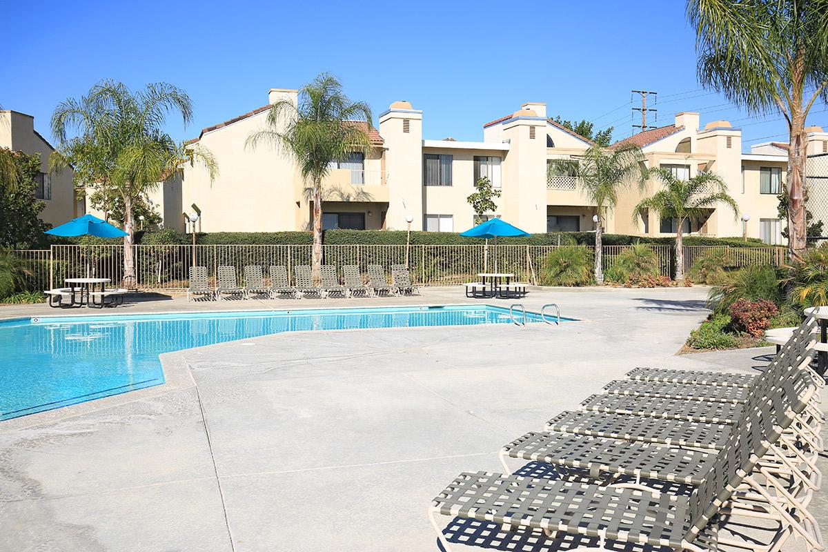 a house with a pool in front of a building