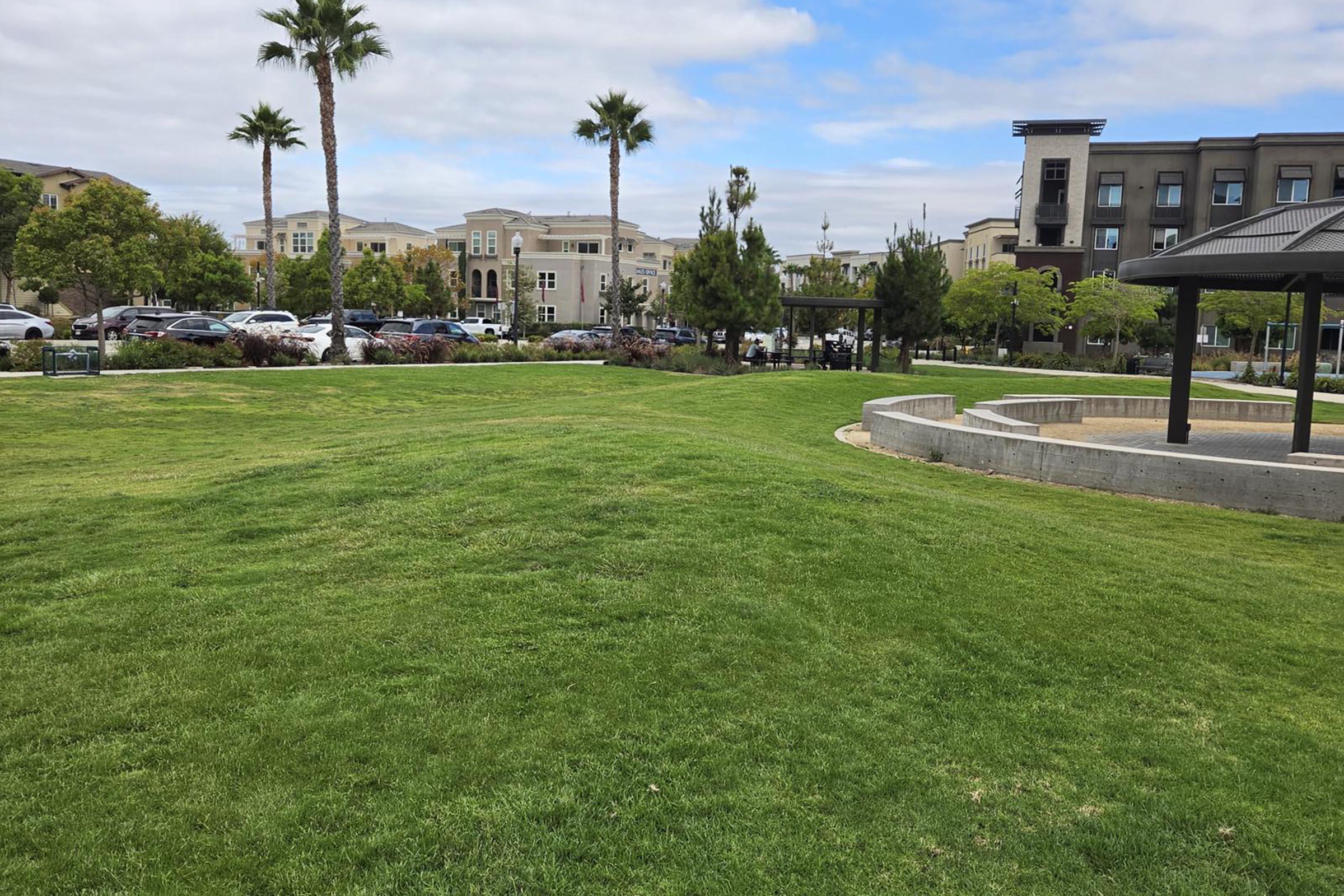 Experience serene outdoor living in our lush green spaces, perfect for relaxing strolls or vibrant community gatherings in a beautifully designed setting.