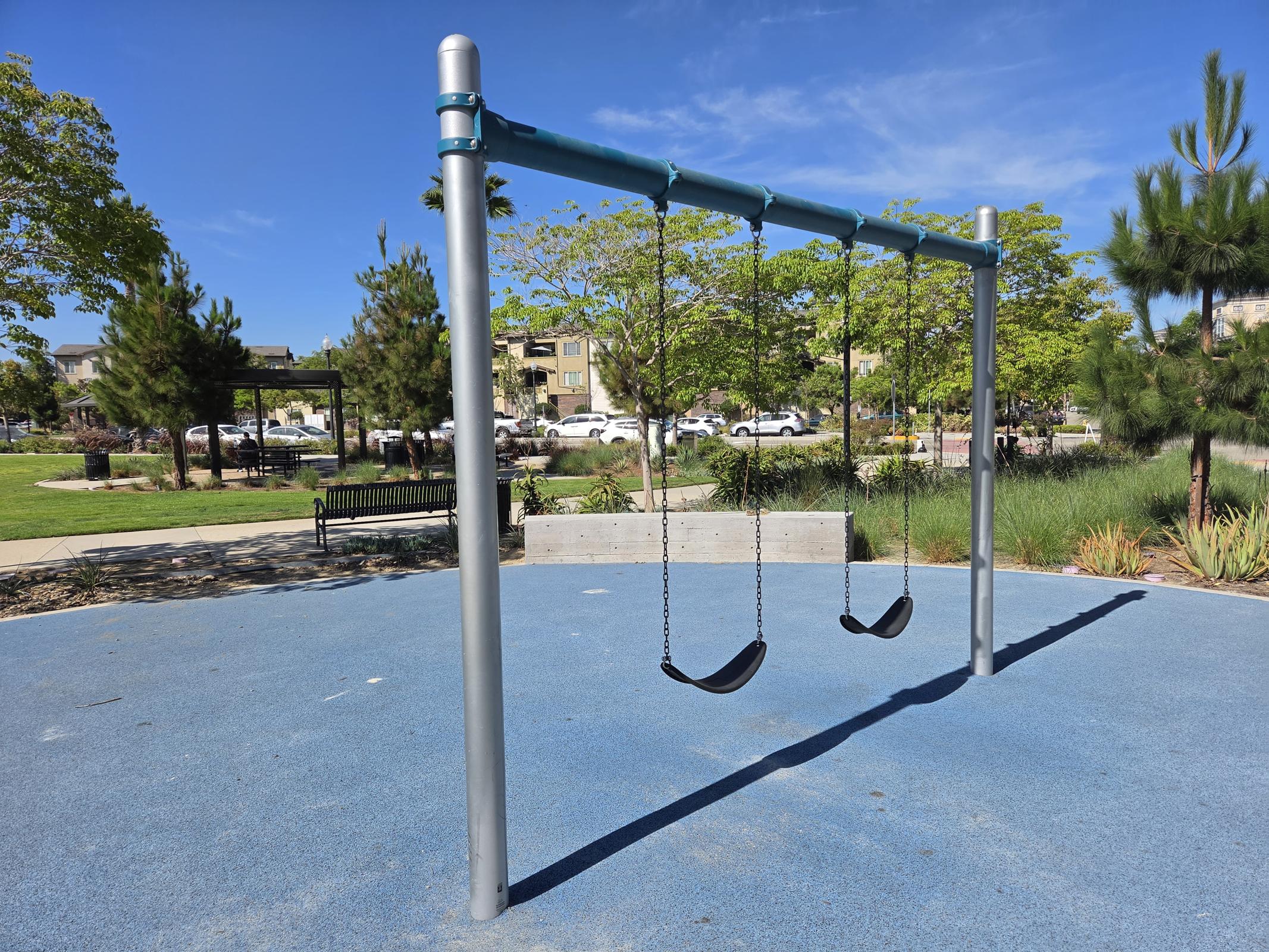 Discover the perfect blend of relaxation and fun in our spacious community park, featuring inviting swings and beautiful landscaping for all ages to enjoy.