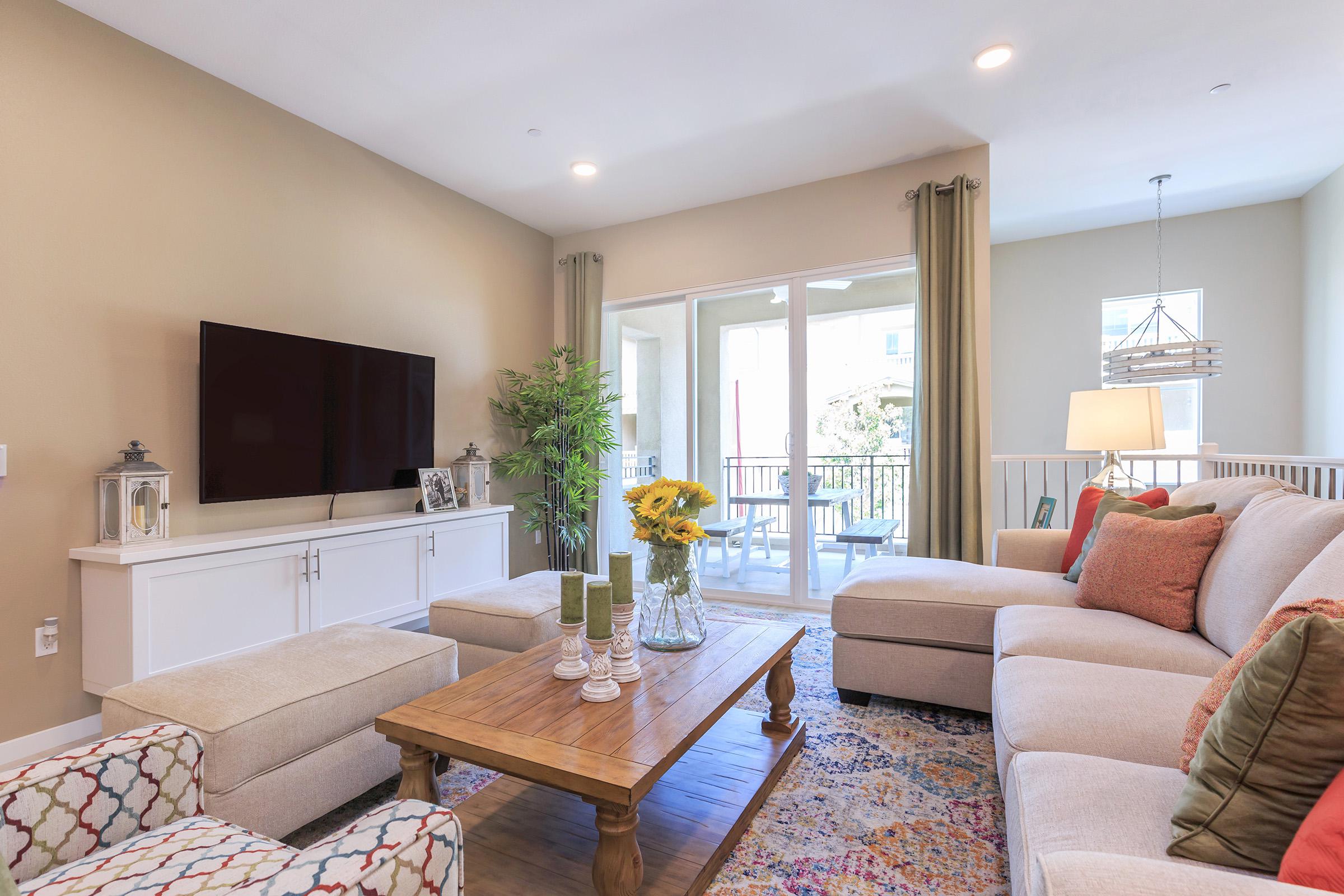 furnished living room with sliding glass doors