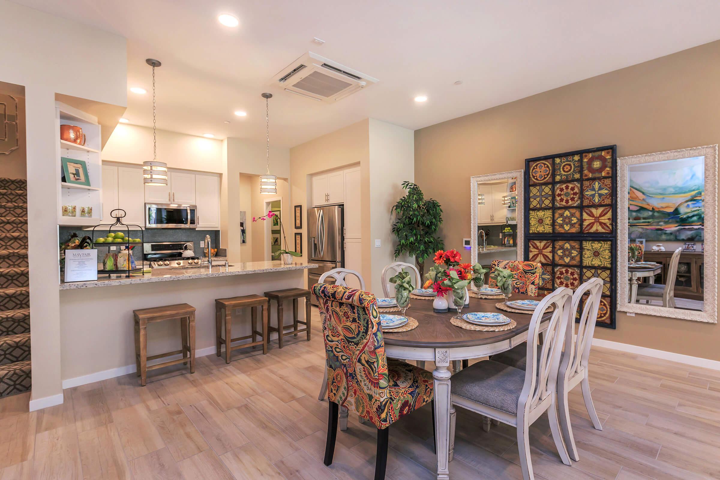 furnished dining room with wooden floors