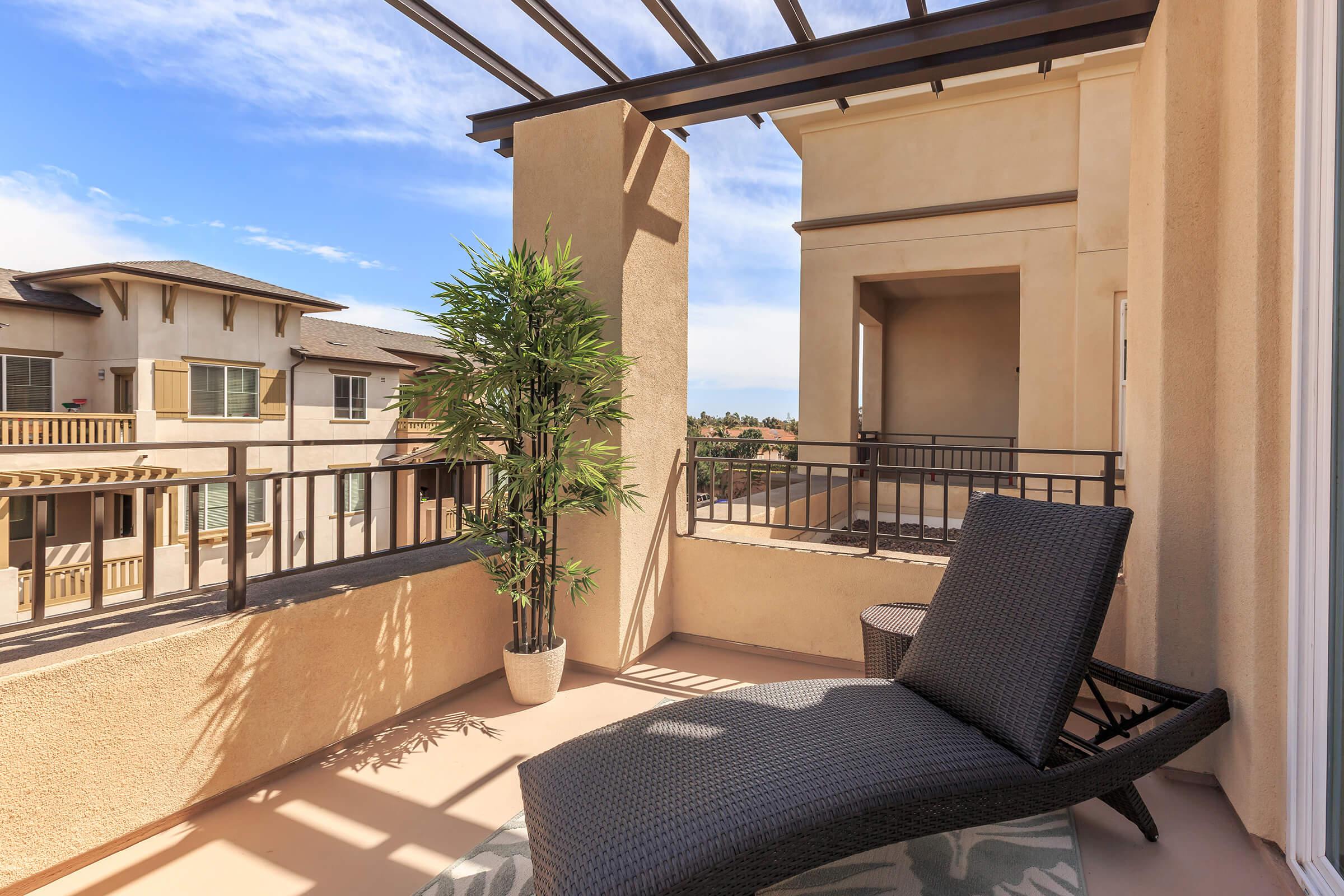 furnished patio with a black lounger