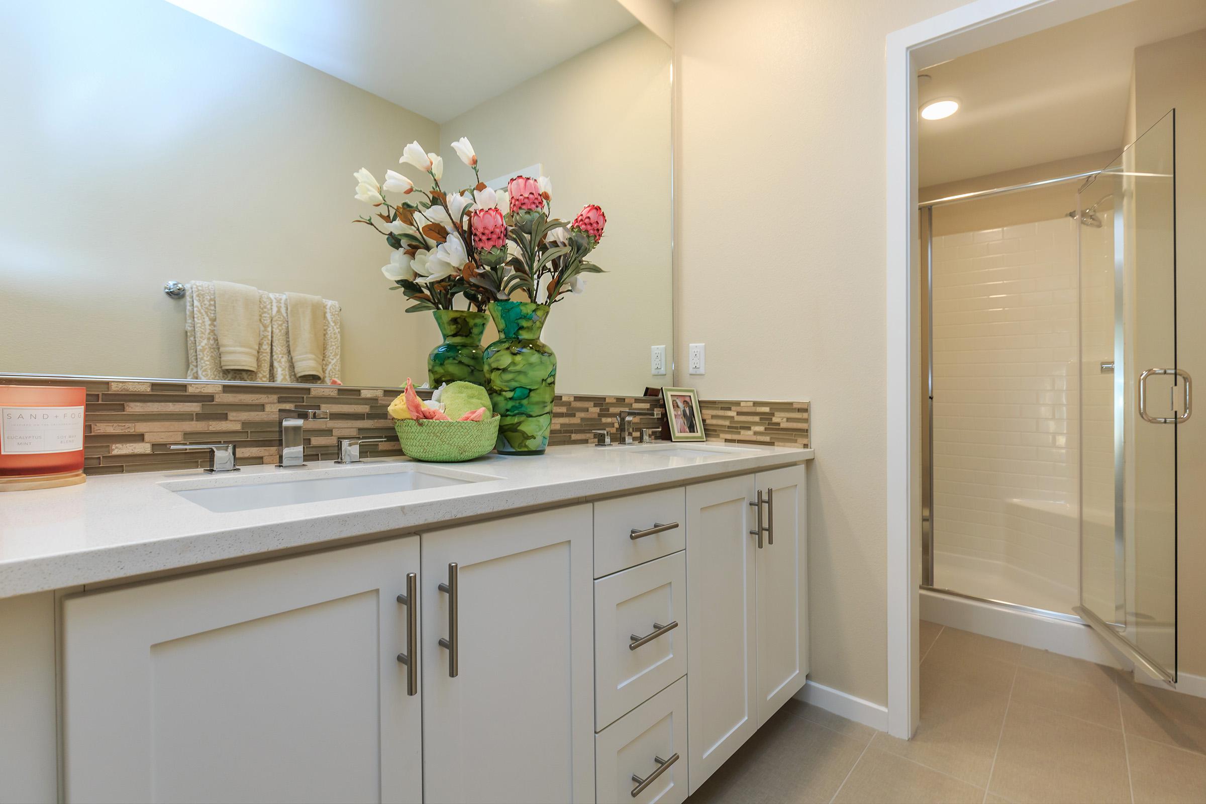 furnished bathroom with glass shower doors