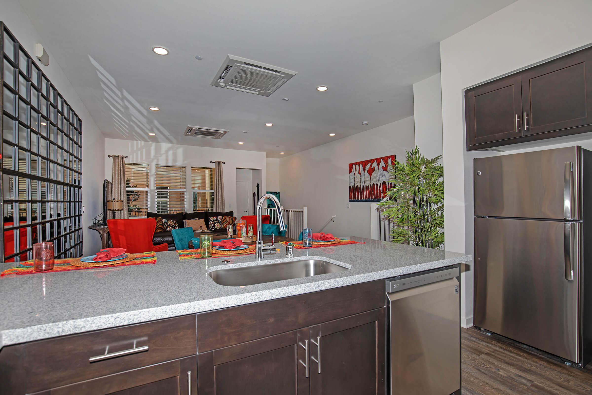 furnished kitchen with a mirror wall