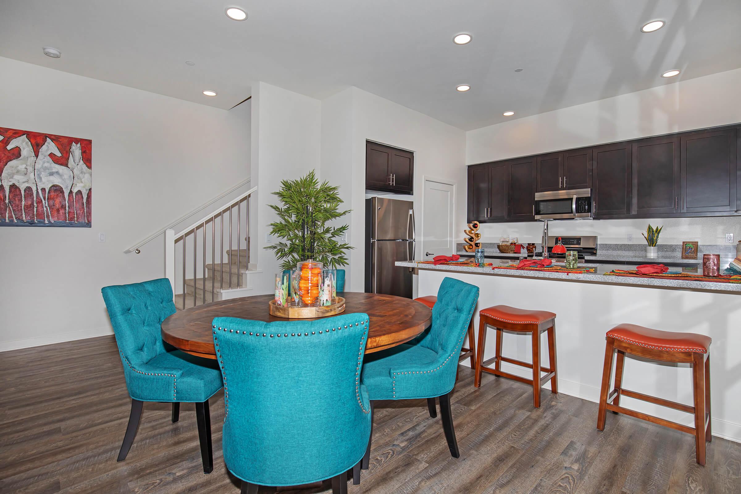 dining room and kitchen with wooden floors