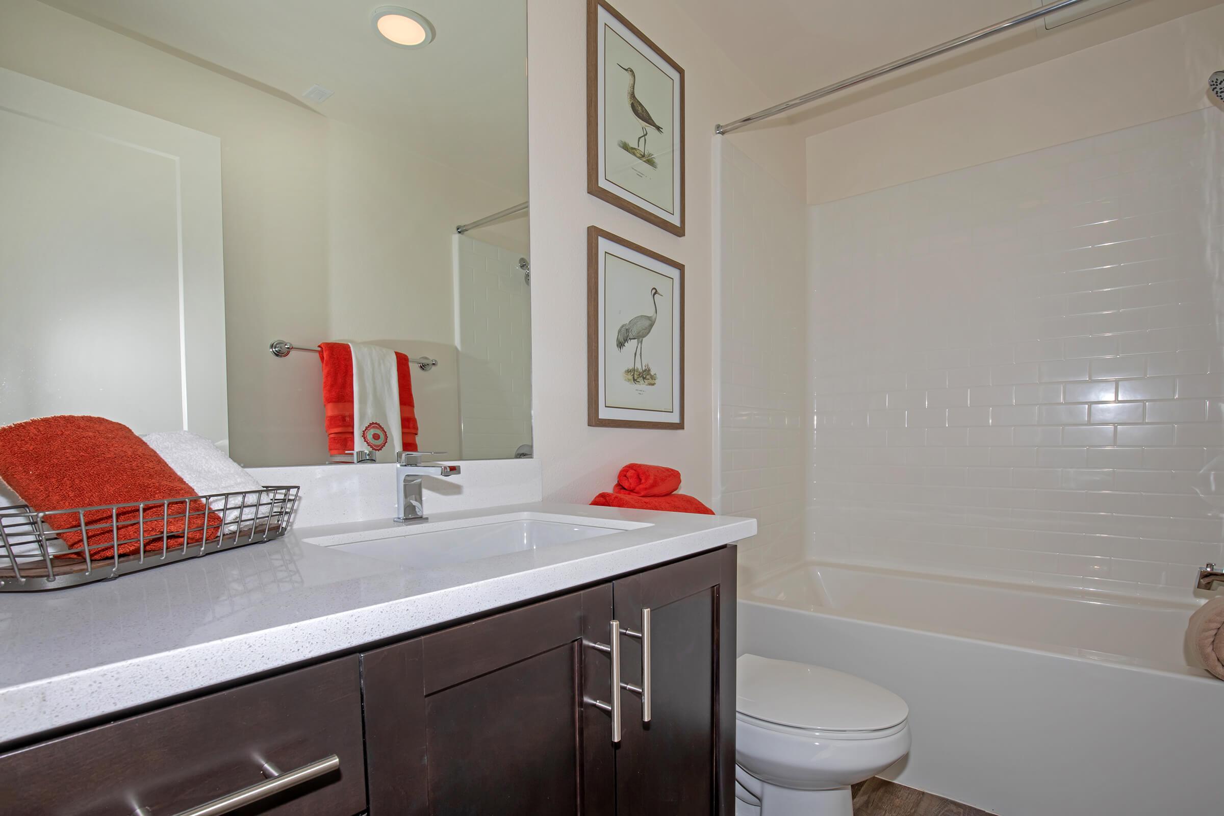 furnished bathroom with white countertops