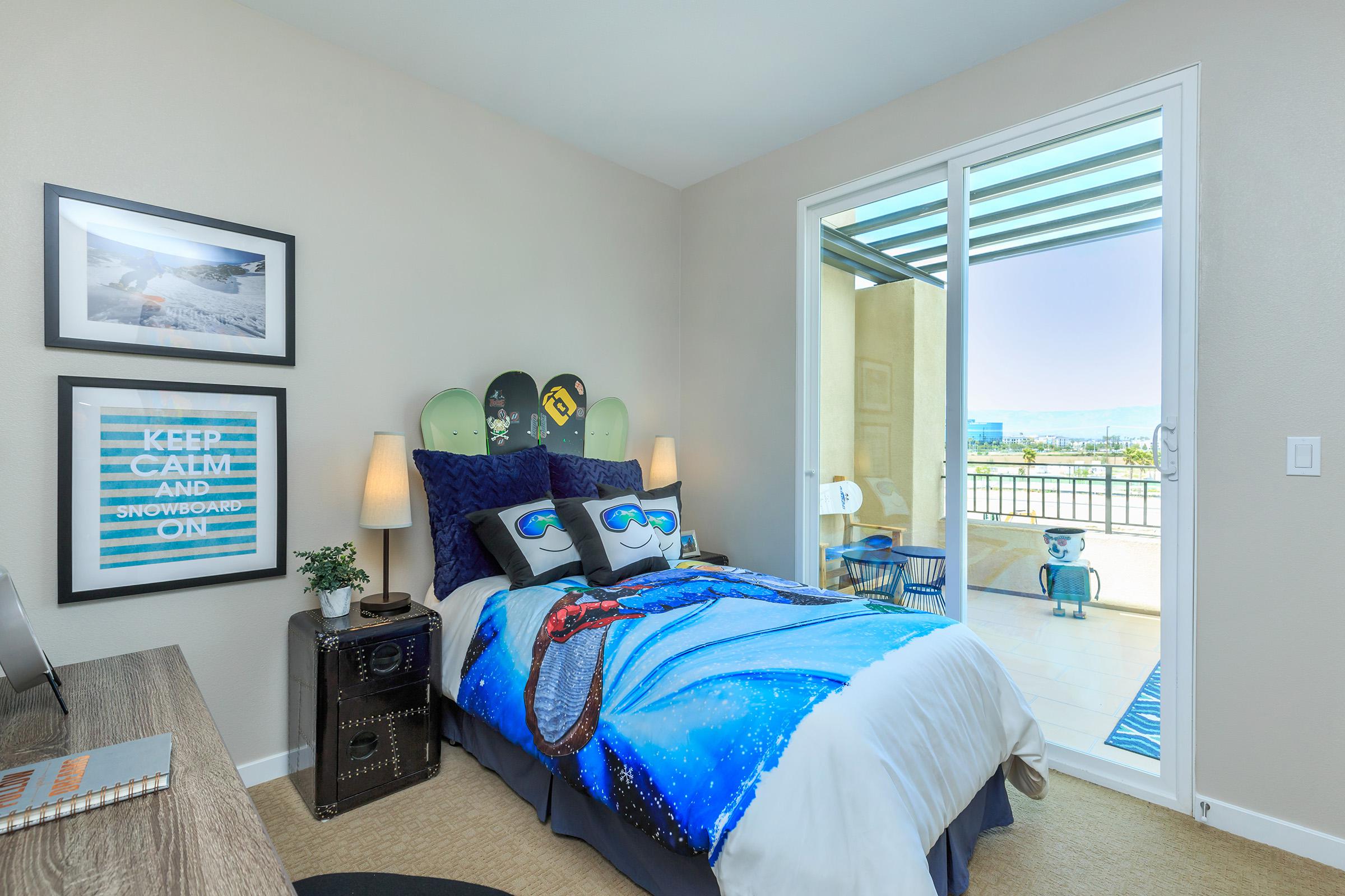 carpeted bedroom with sliding glass doors