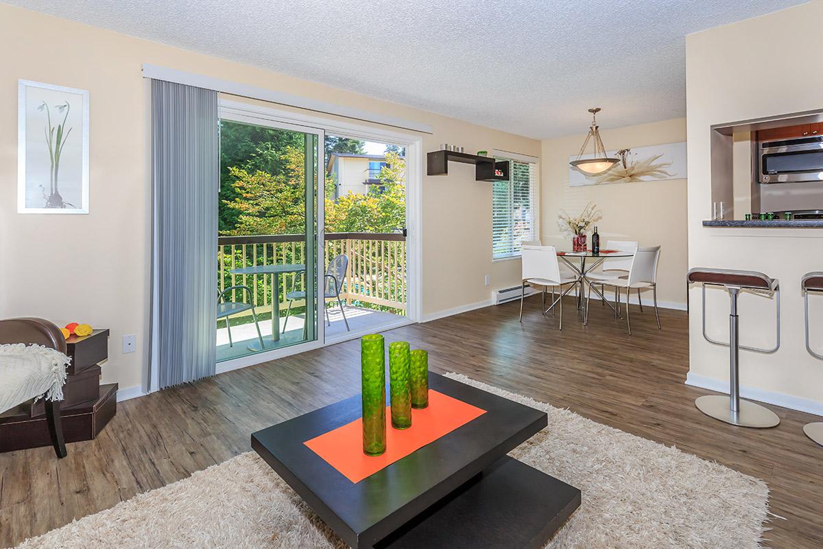 a living room filled with furniture and a flat screen tv