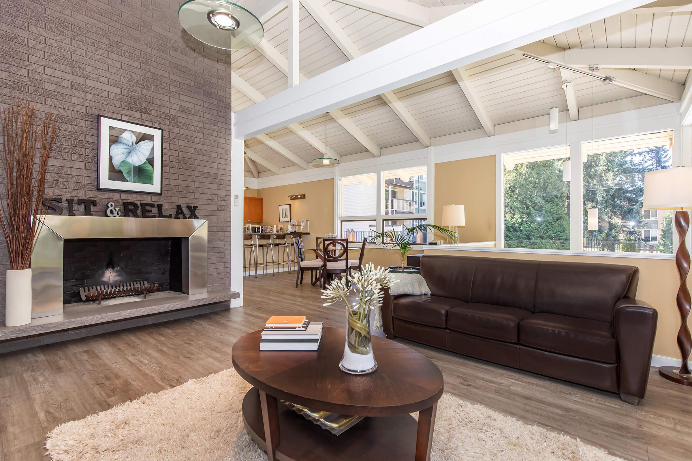 a living room filled with furniture and a fireplace