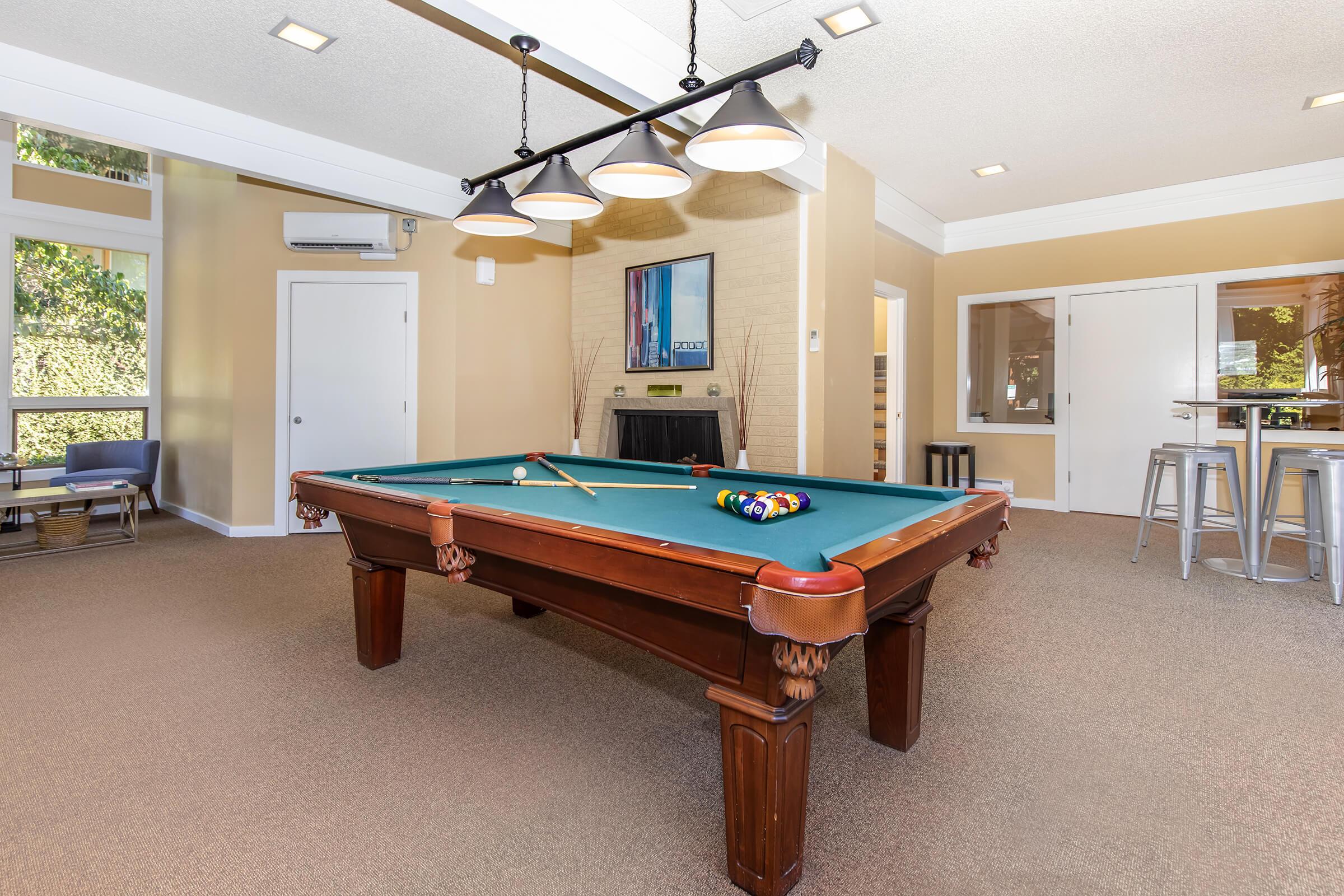 a living room filled with furniture and a large window