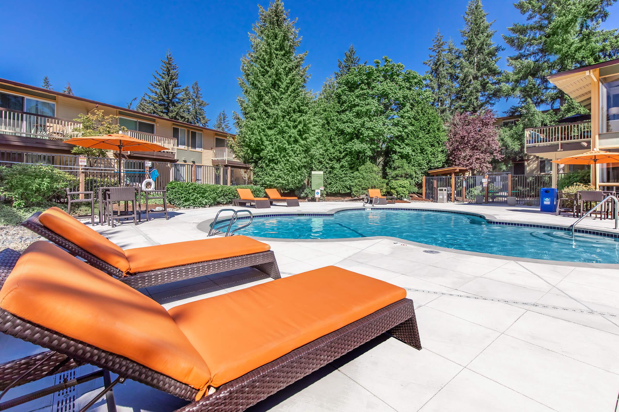 a chair sitting in front of a pool