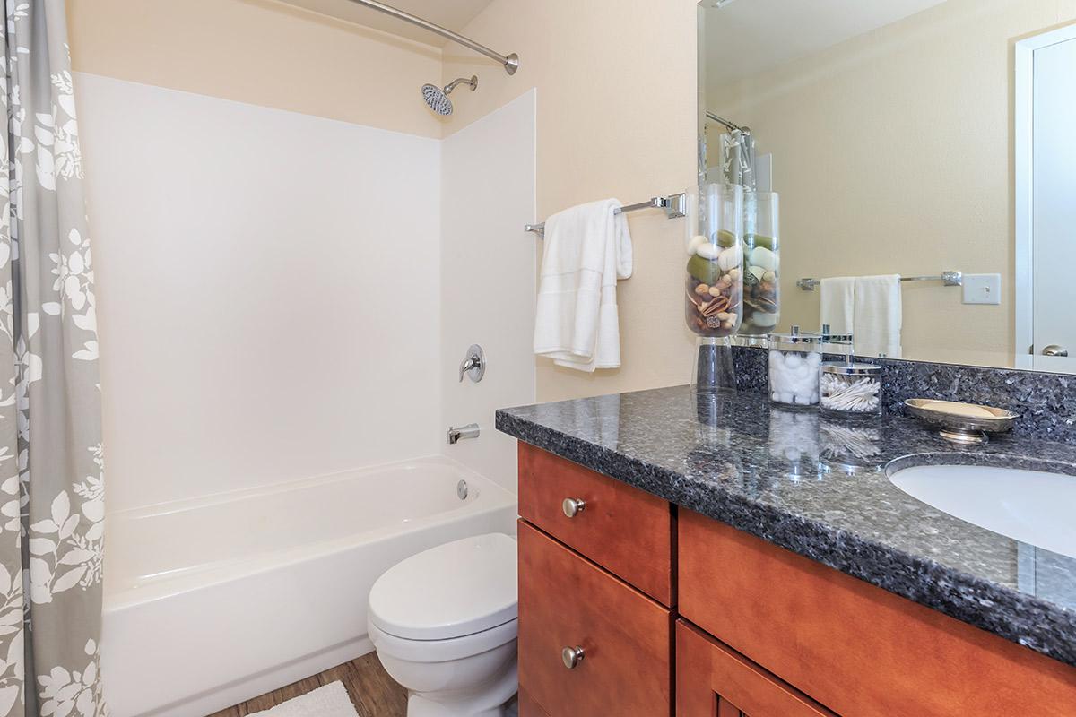 a kitchen with a sink and a mirror