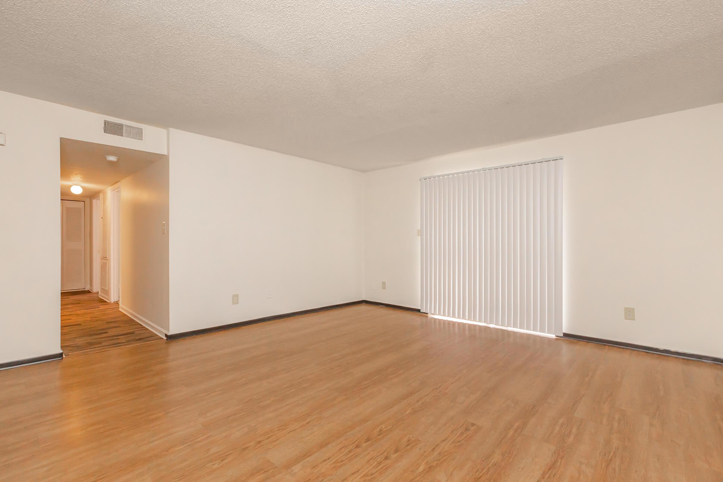 a kitchen with a wood floor