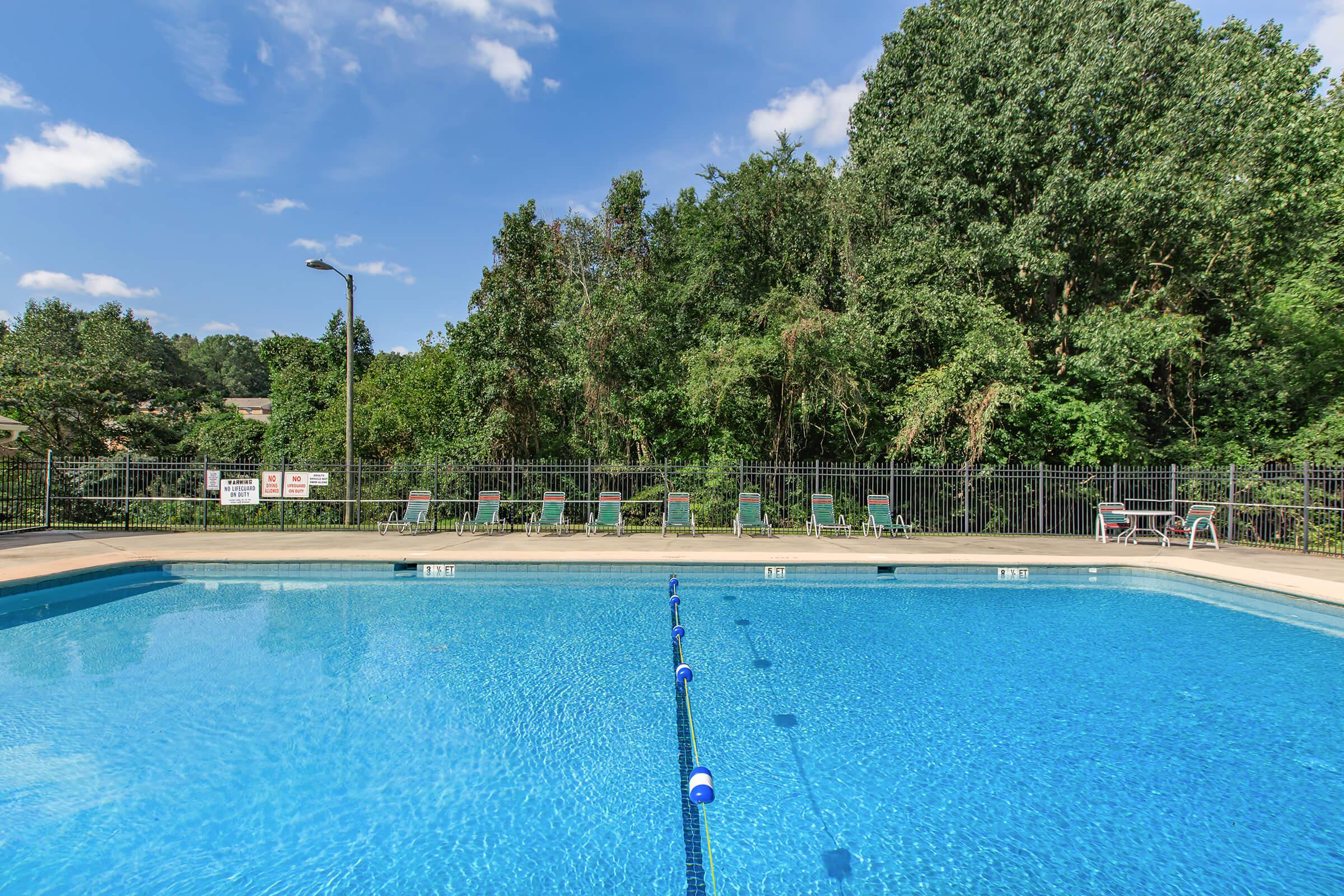 a pool next to a body of water