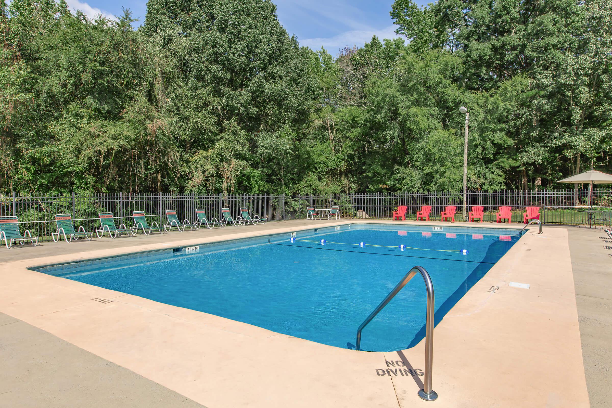 a pool next to a body of water