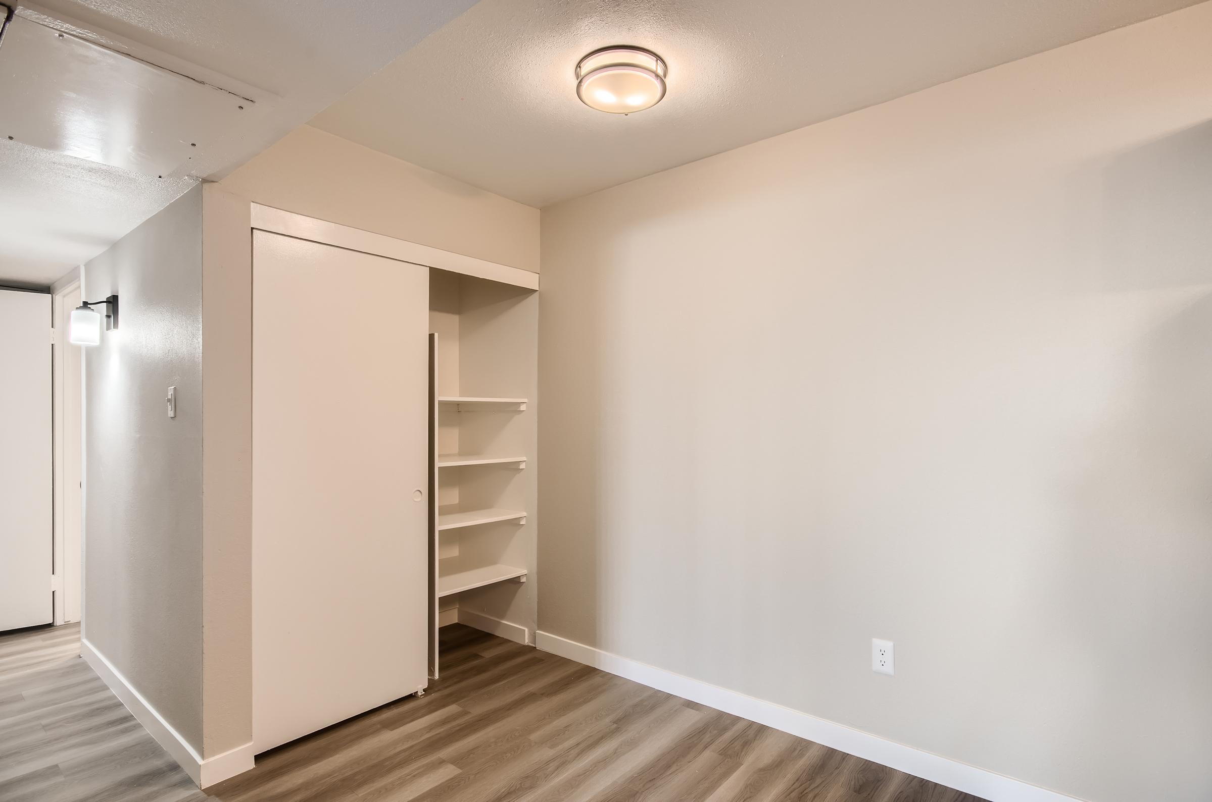 An open closet in the dining area at Rise on McClintock