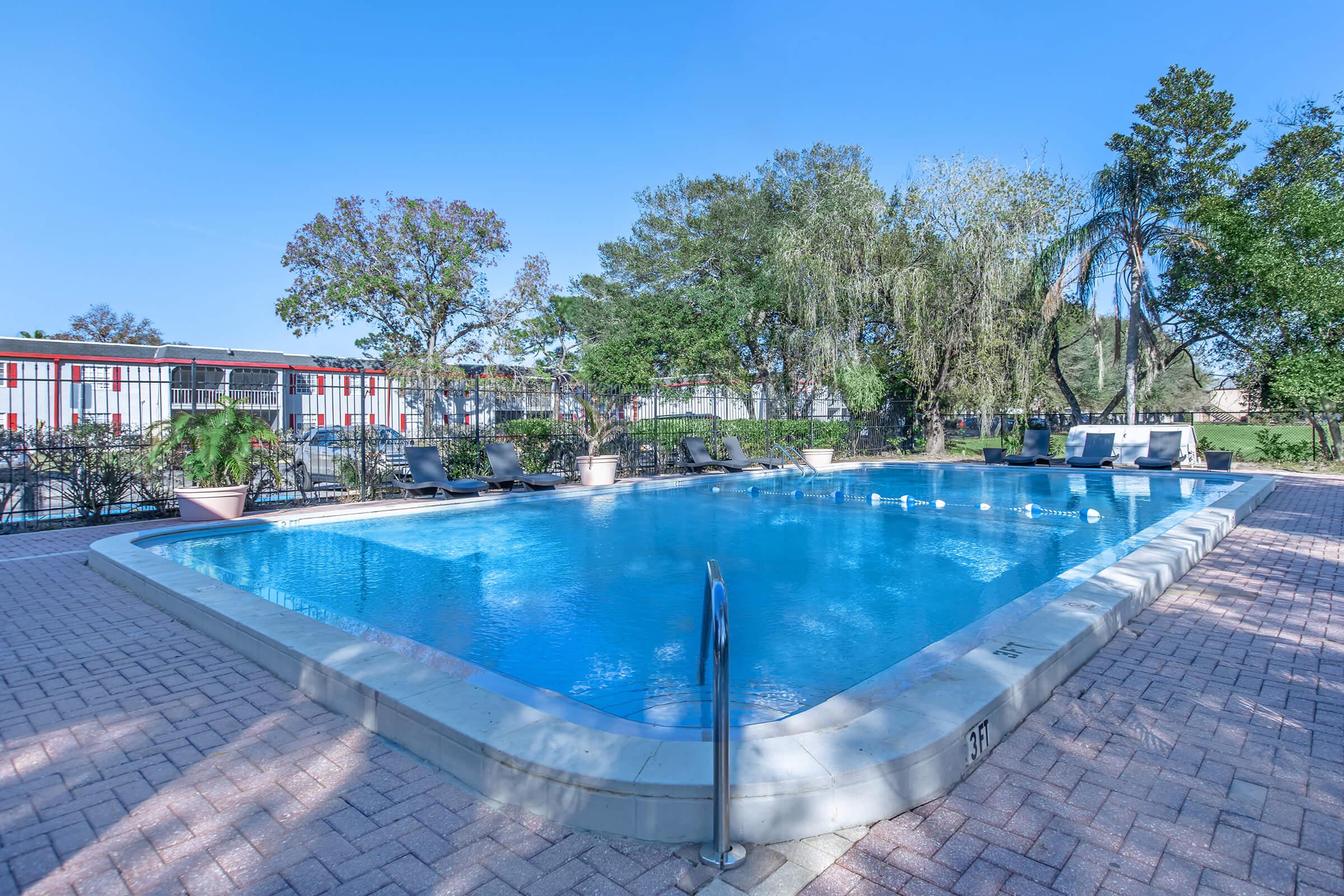 a pool next to a body of water