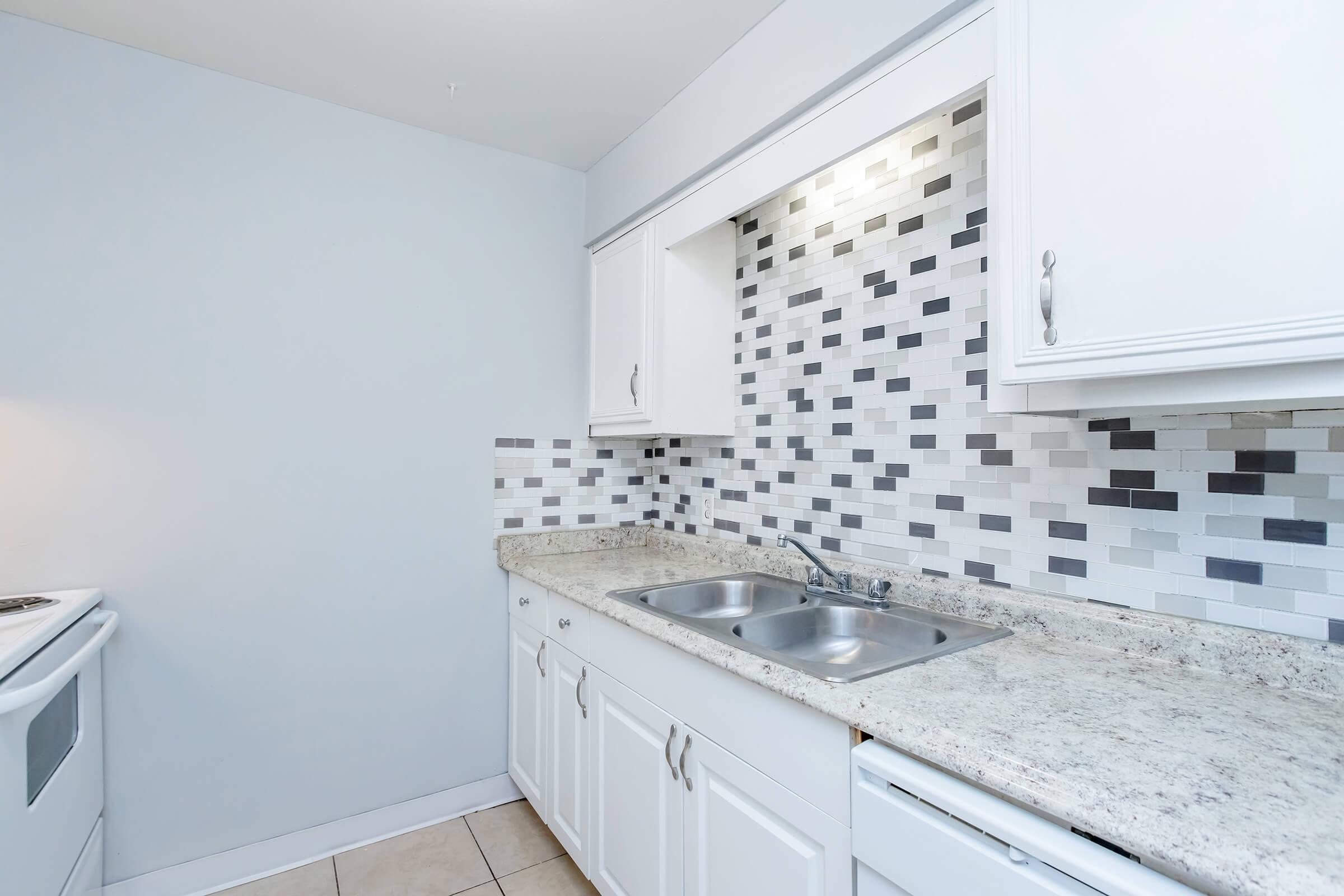 a kitchen with a sink and a window