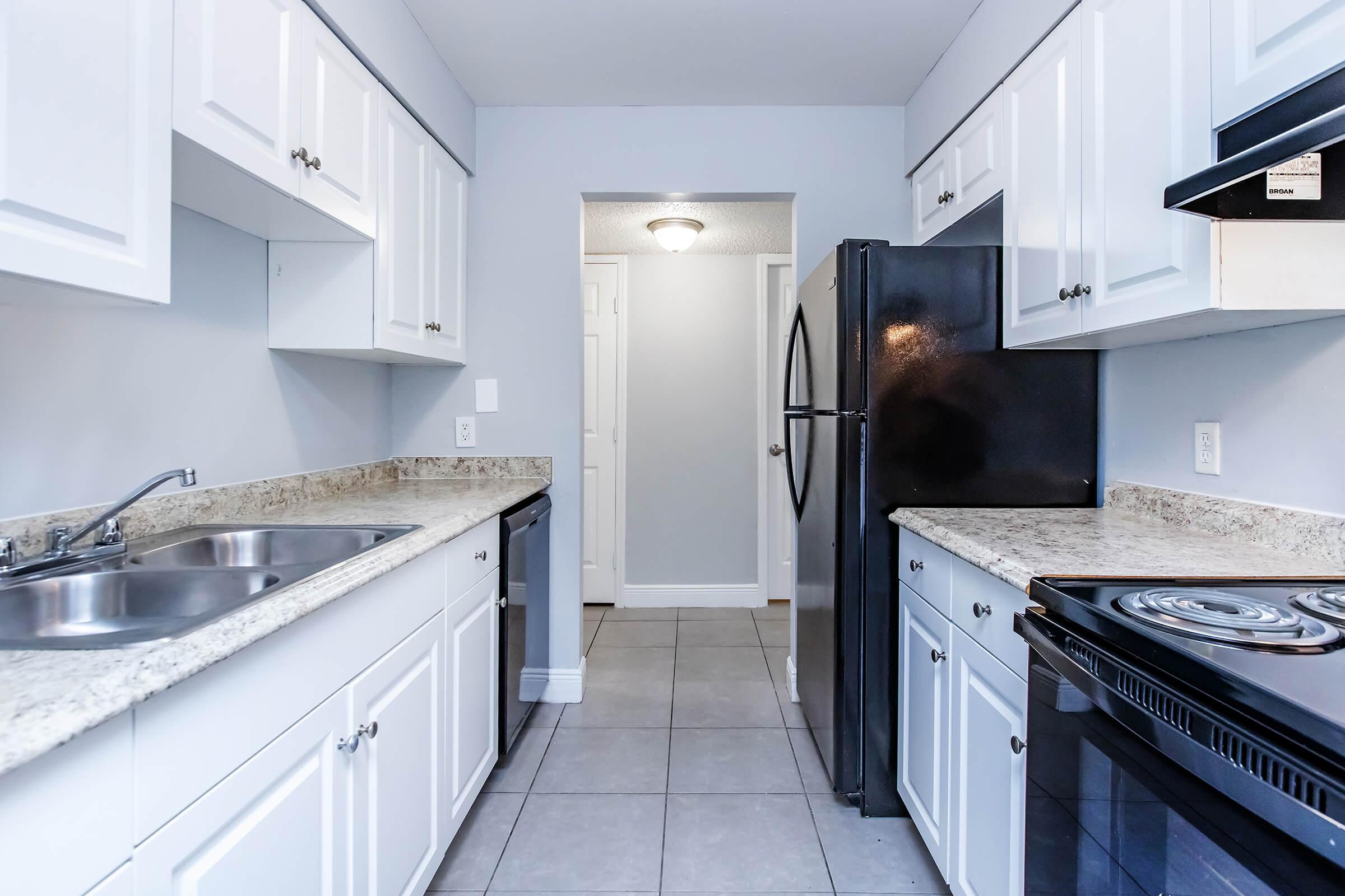 a kitchen with a stove top oven