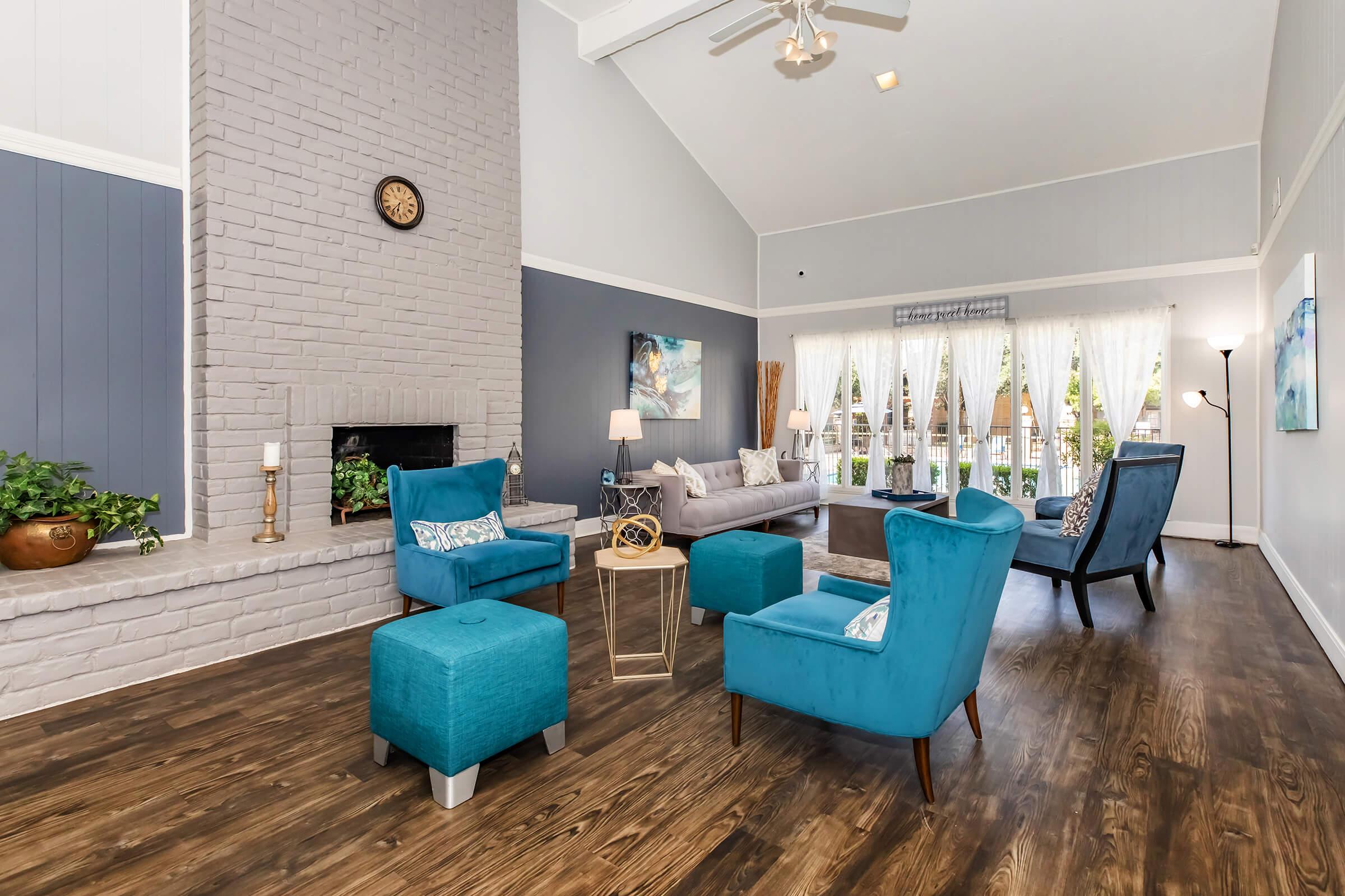 a room filled with furniture and a blue chair