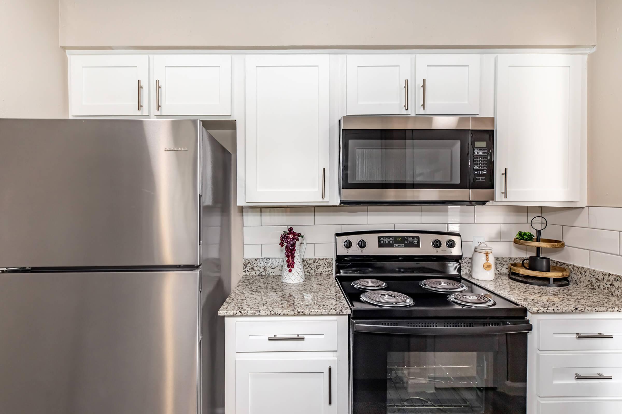 a kitchen with a stove top oven sitting inside of a refrigerator