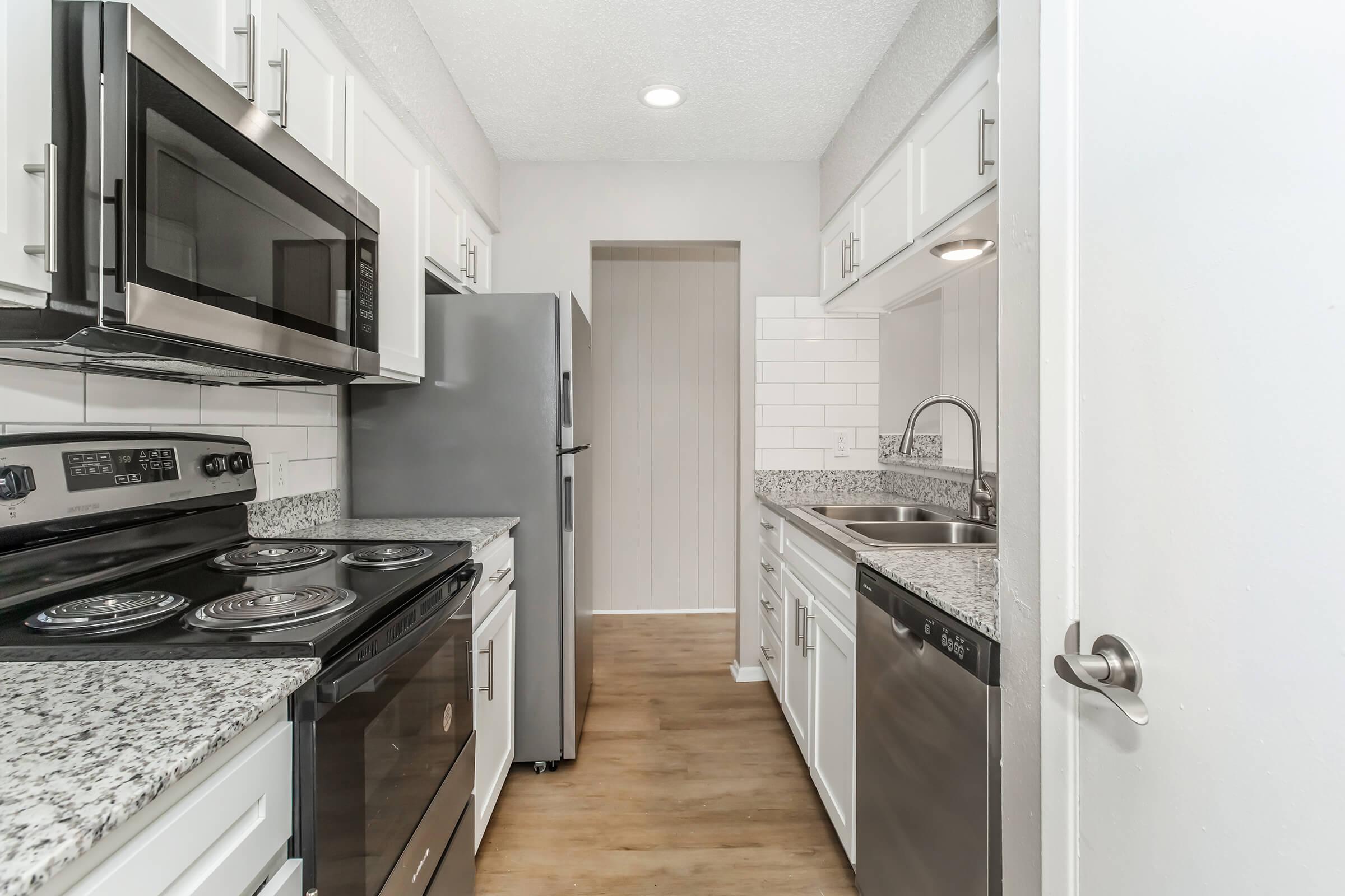 a kitchen with a stove and a sink